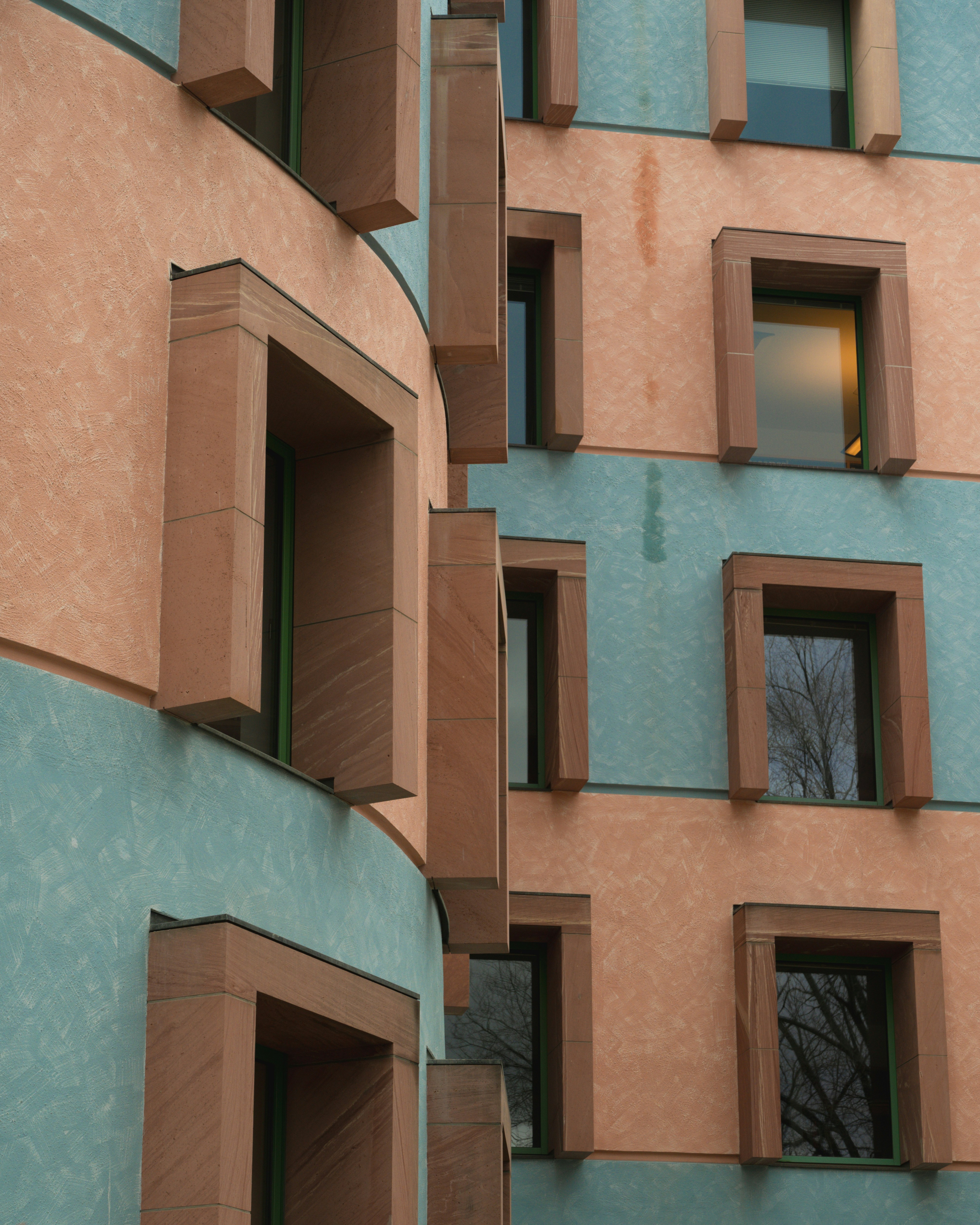 Abstract architectural detail with repeating window patterns.