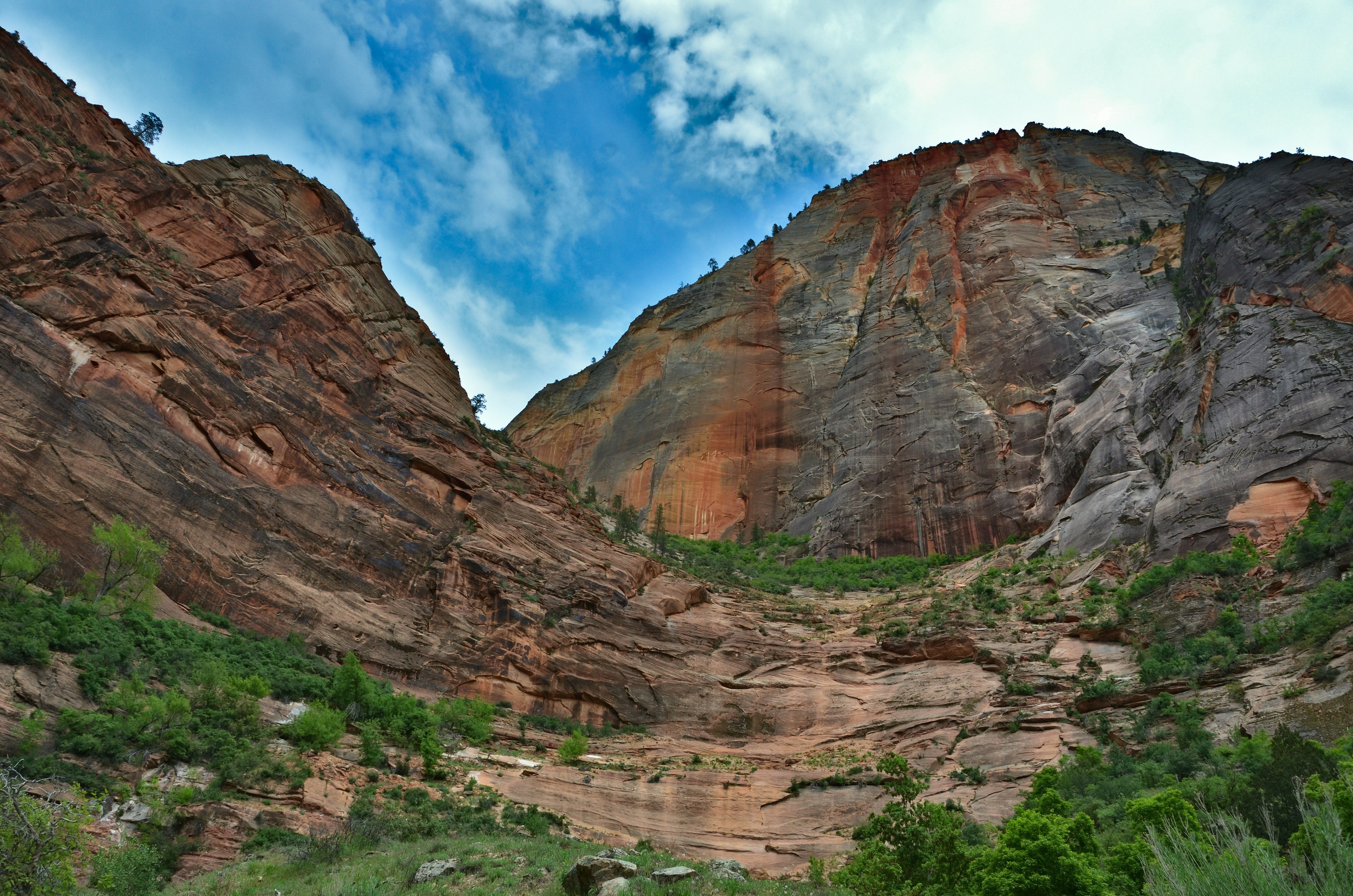 Towering sandstone cliffs under a blue sky