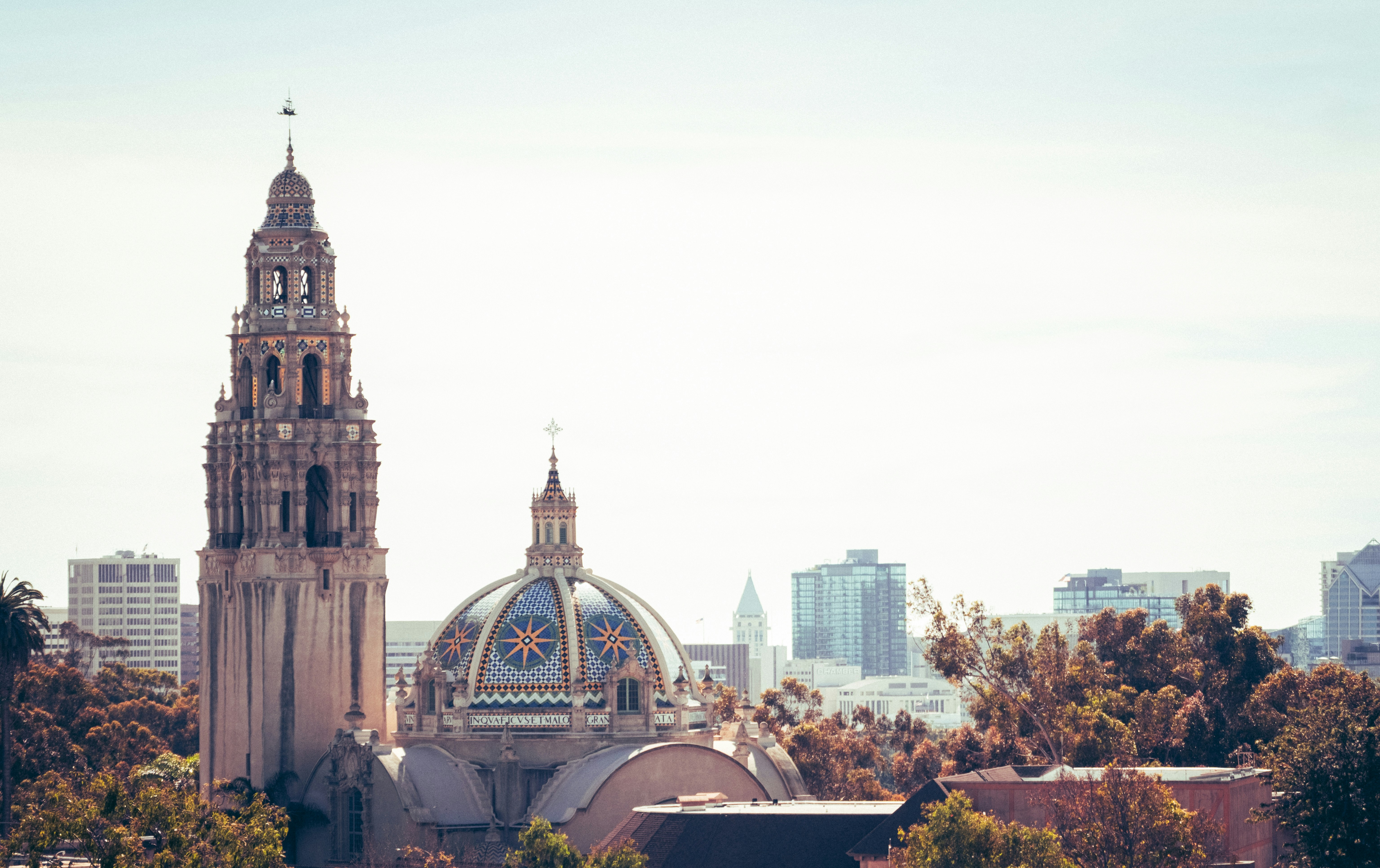 Ornate domed building with a tall tower and cityscape.
