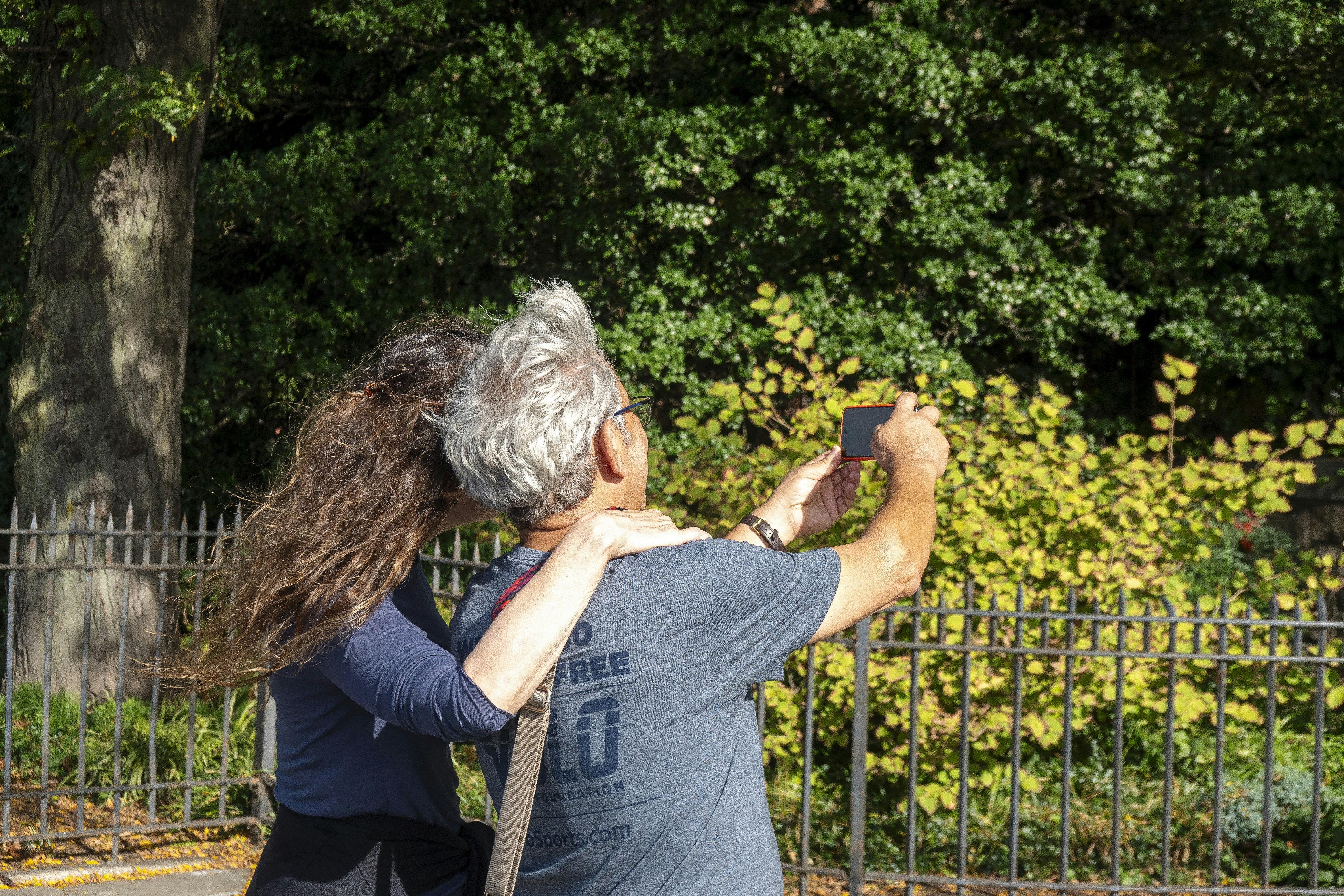 Couple taking a selfie in a park