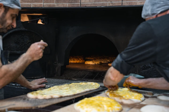 Flatbreads baking in a traditional stone oven