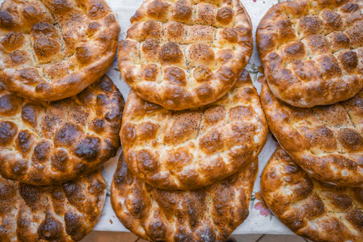 Stack of freshly baked flatbreads with golden crust.