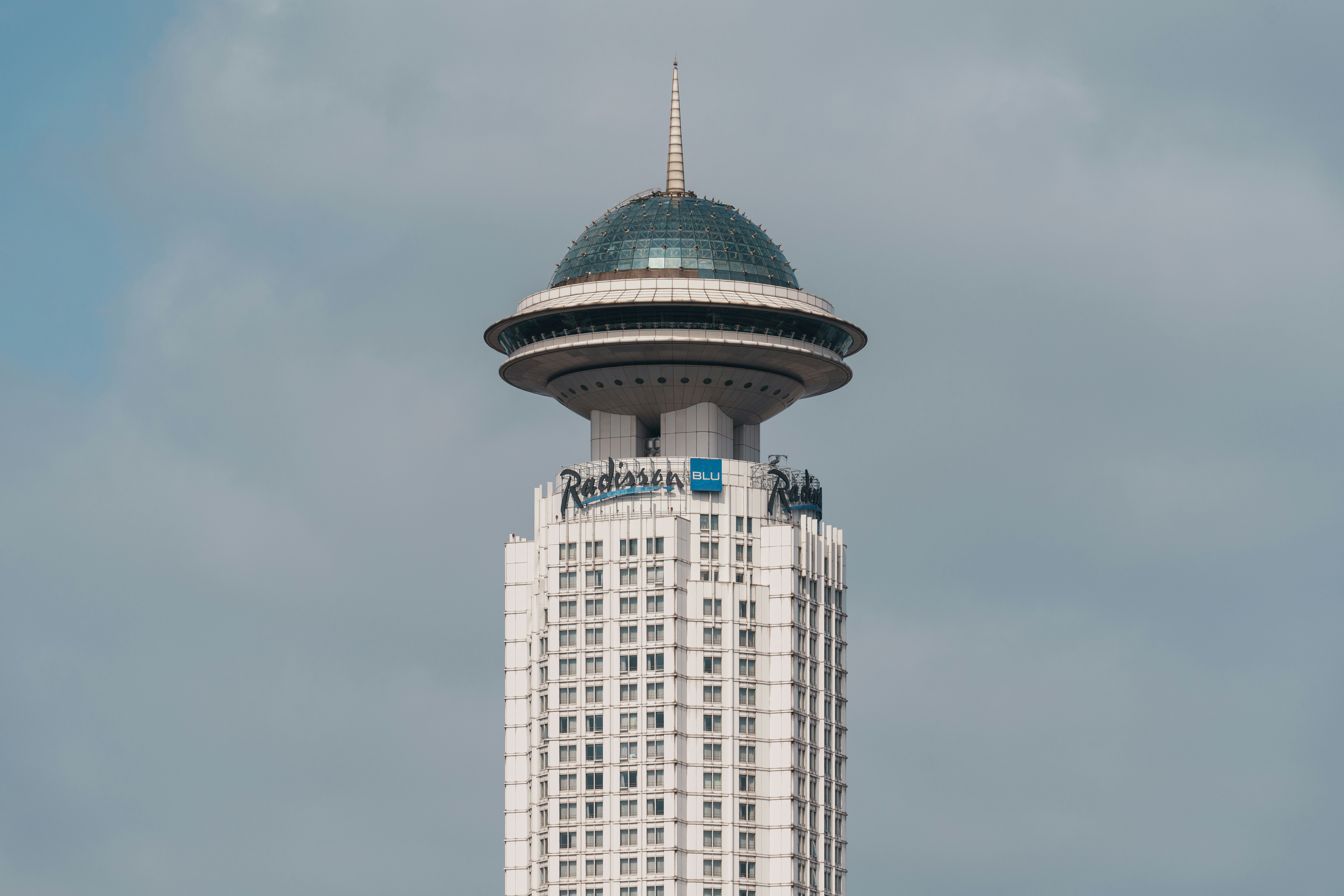 Tall white skyscraper with a domed top