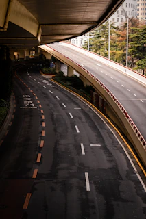 Empty elevated highway with city buildings in background