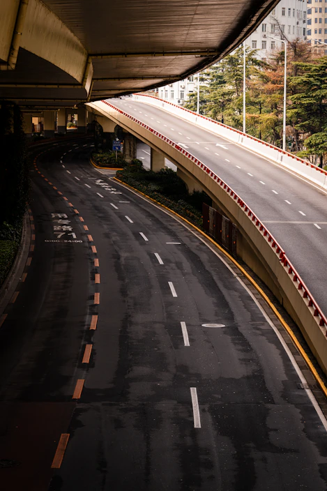 Empty elevated highway with city buildings in background