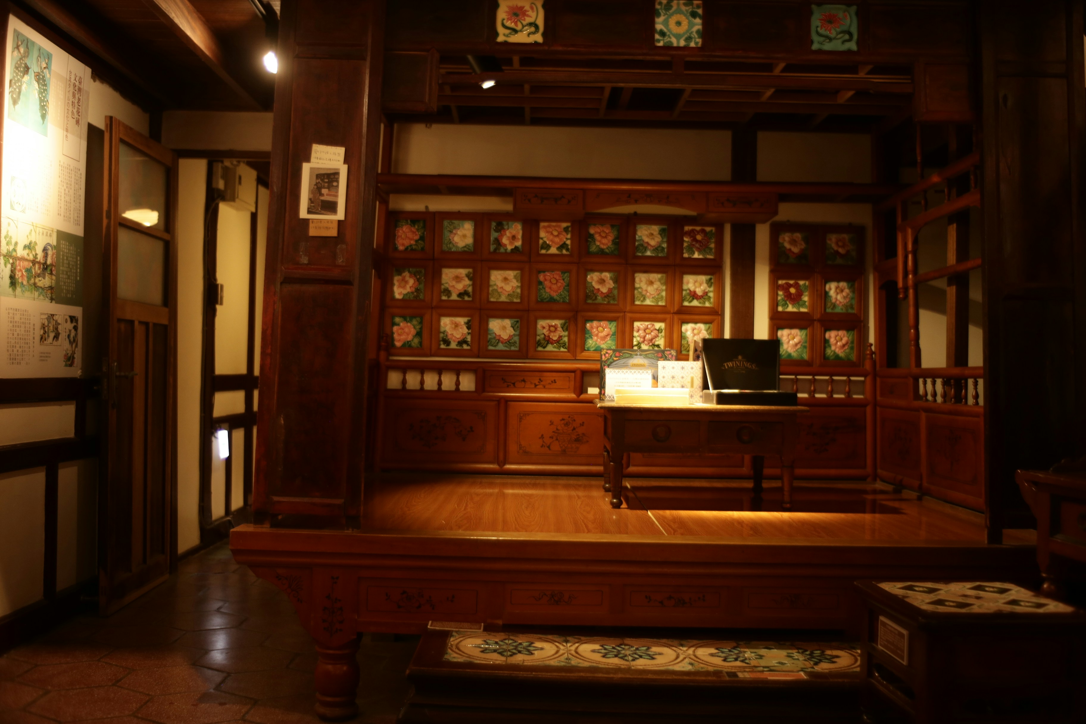 Wooden display with framed art and computer