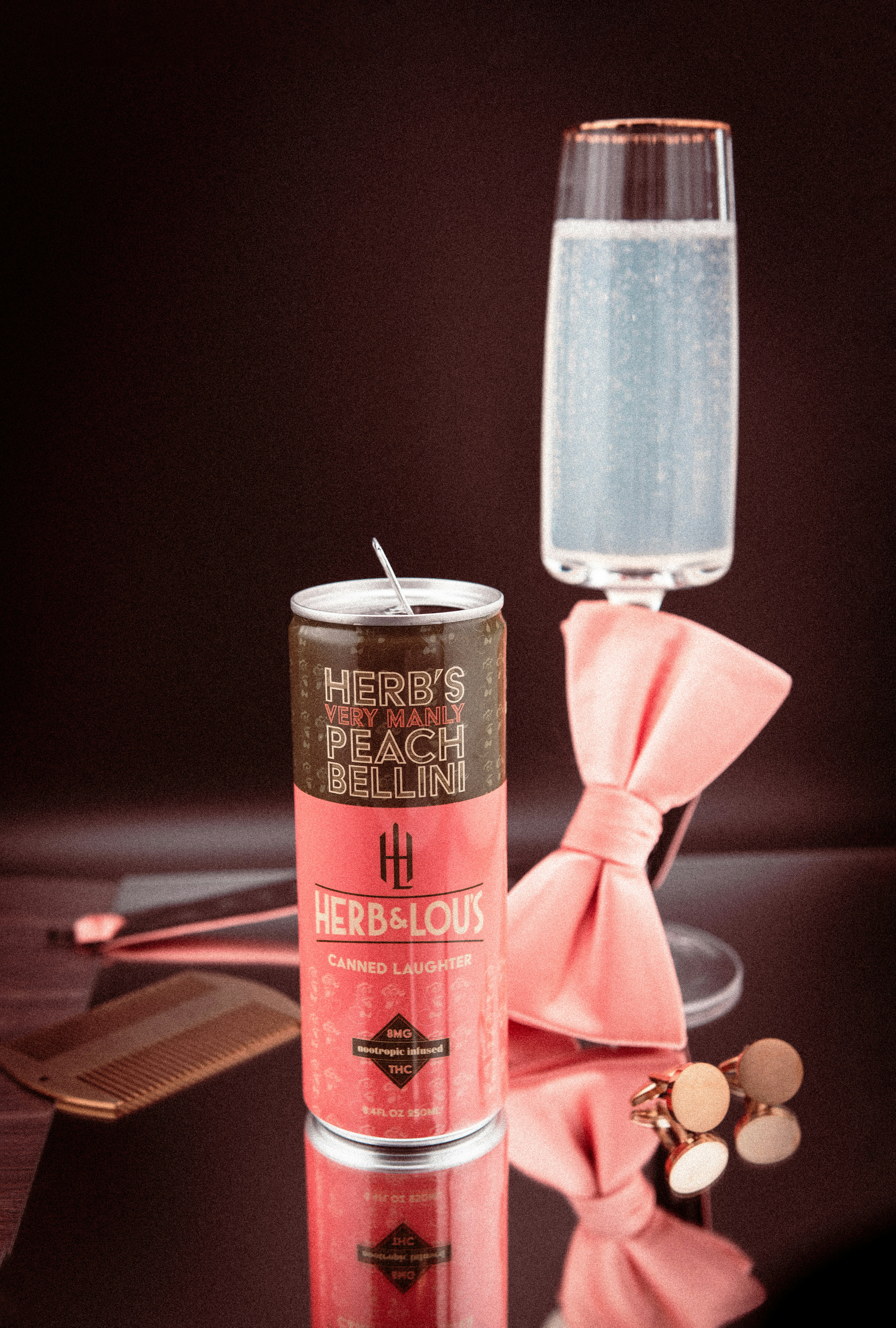 Peach bellini drink with bowtie and cufflinks