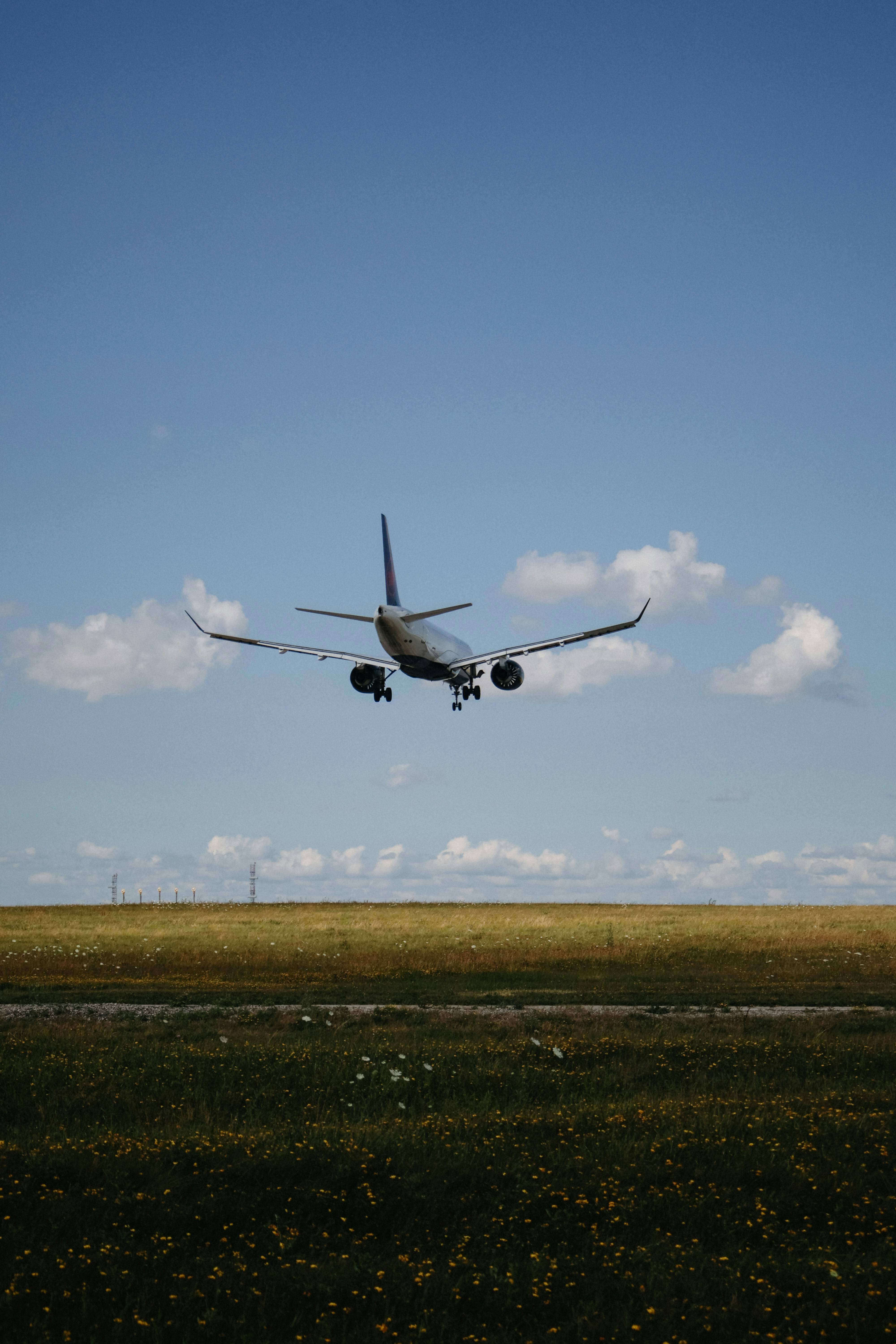 Airplane descending for landing on a sunny day