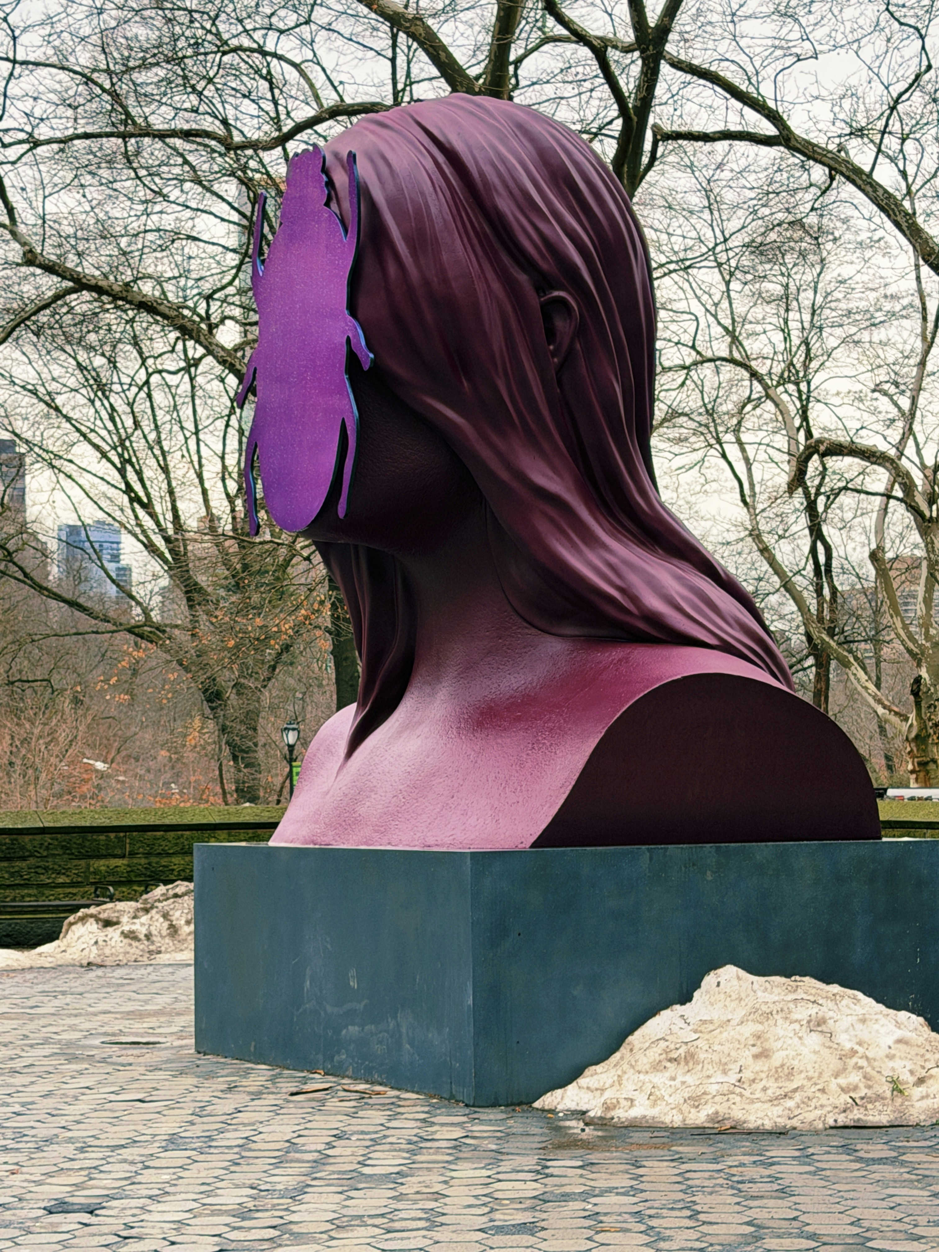A large abstract sculpture of a woman's head