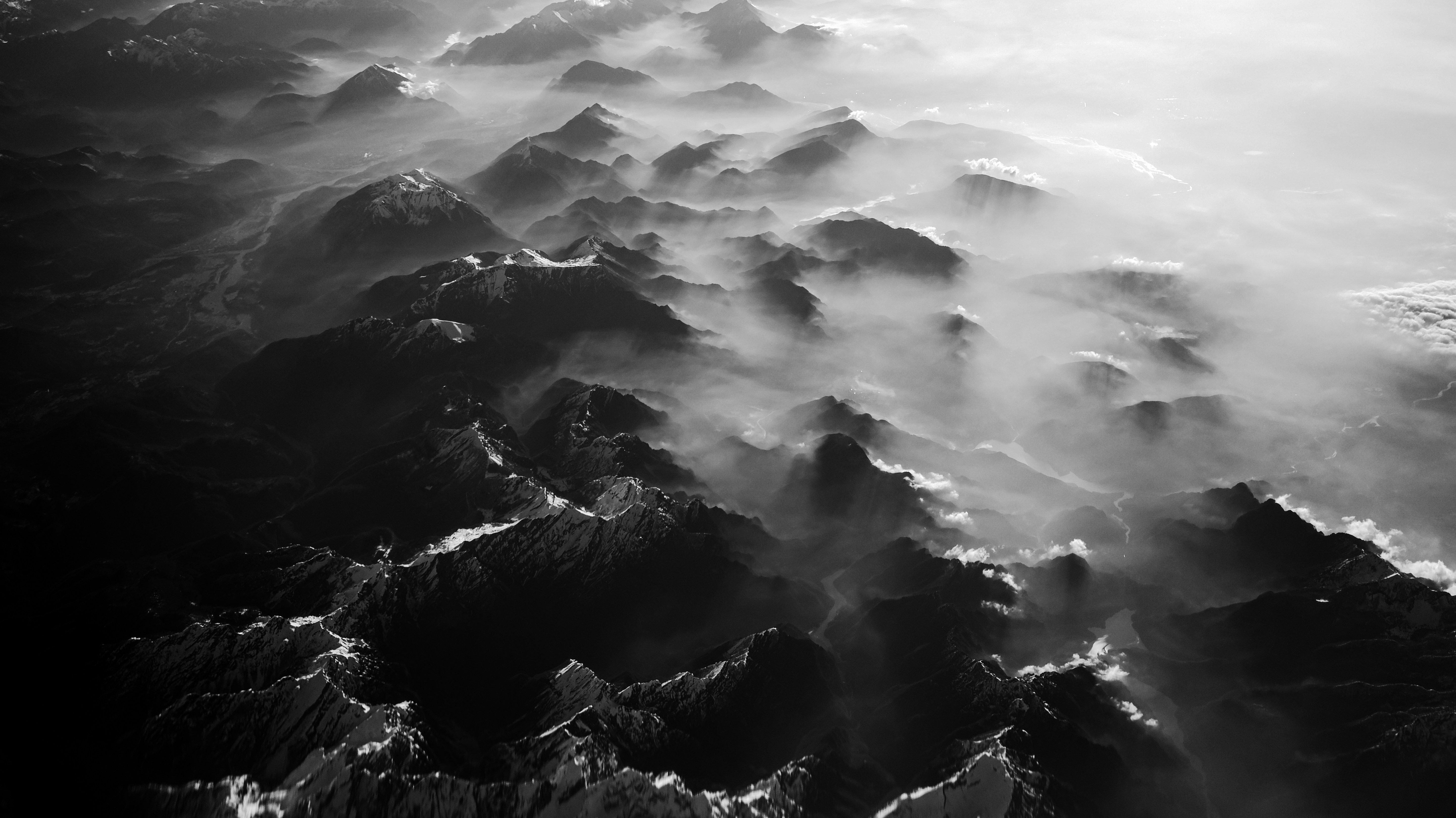 Misty mountain range from above in the air