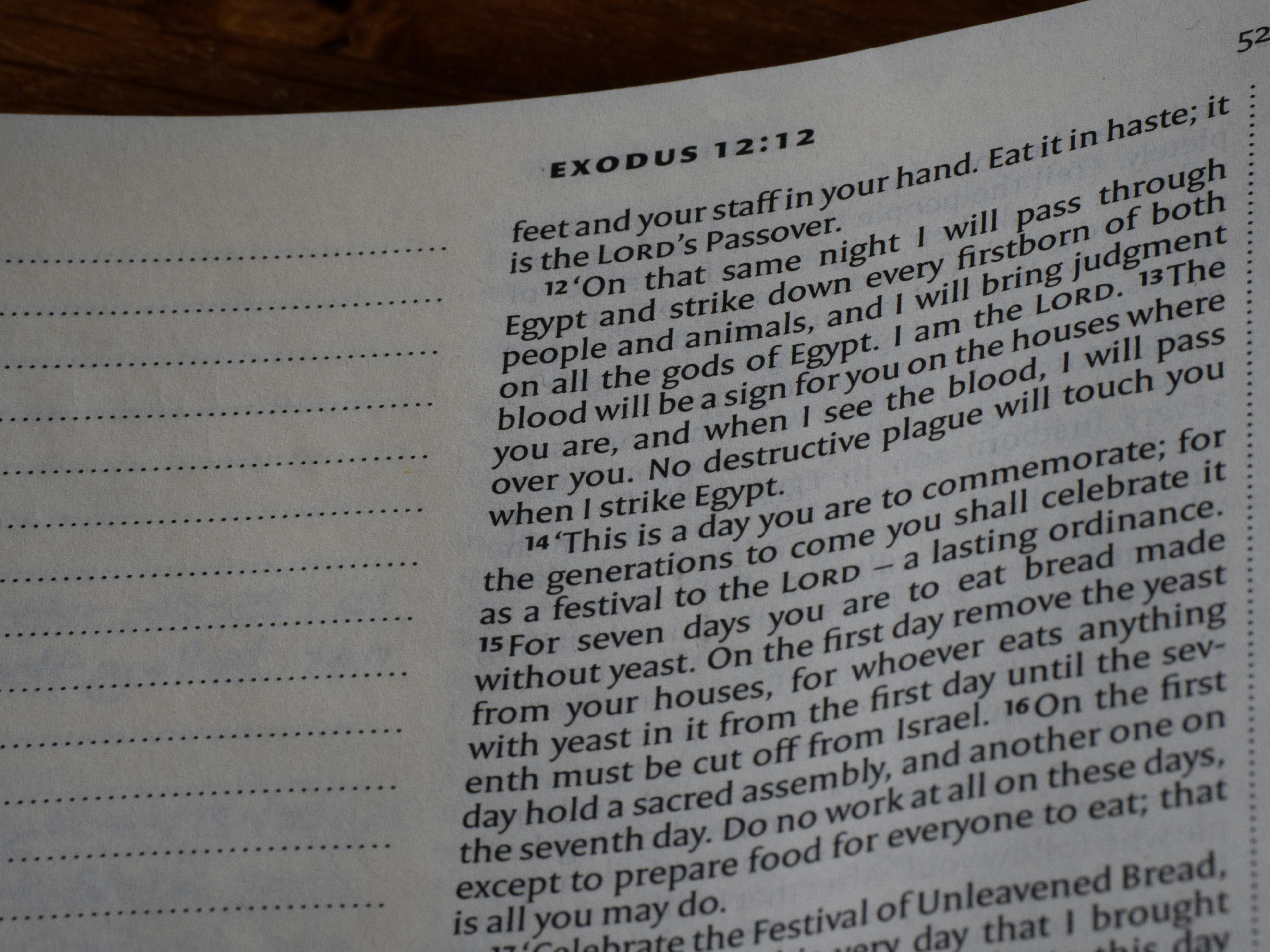 Close-up of an open book with text on pages.