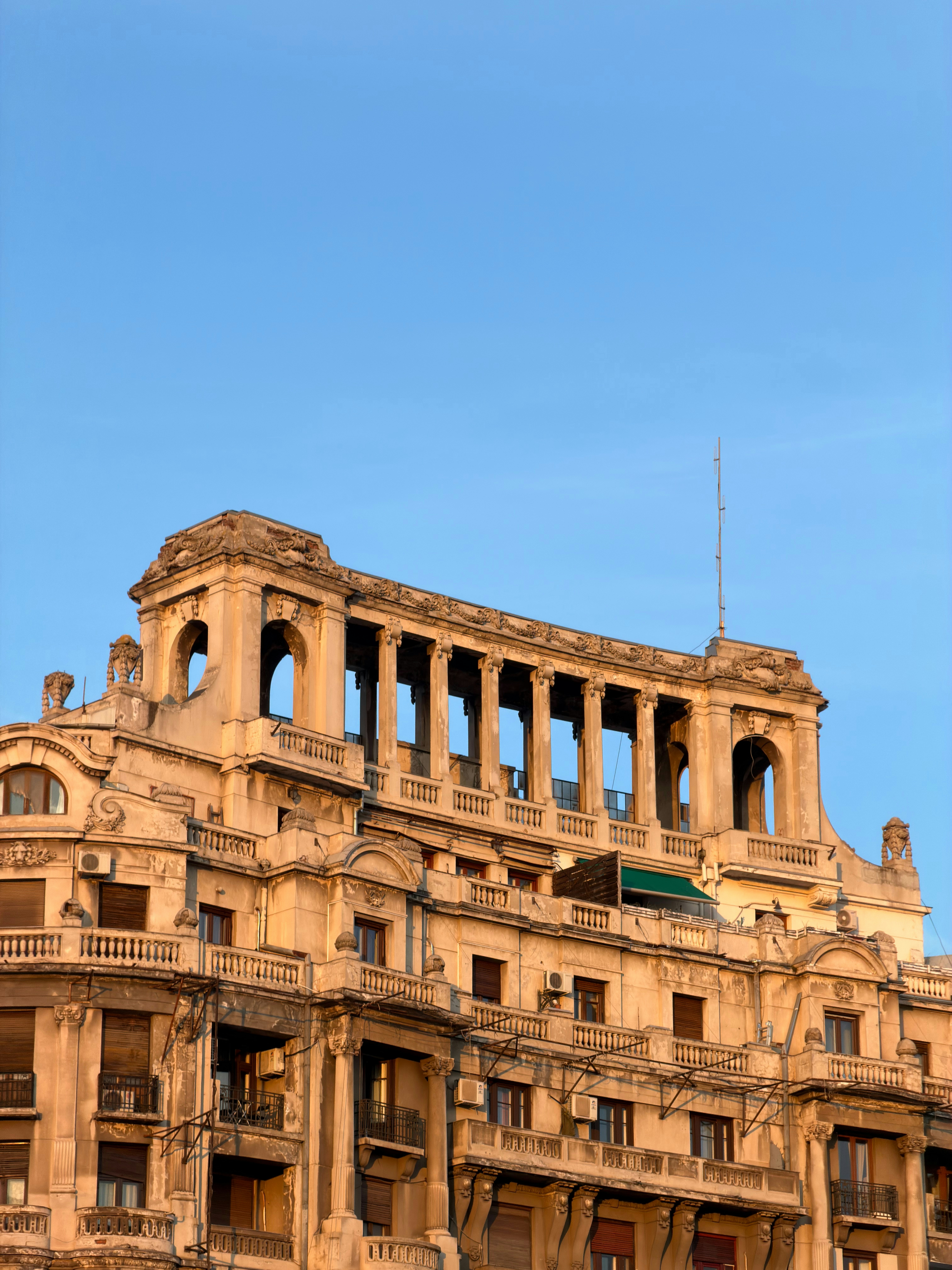Ornate building with classical architectural details against sky