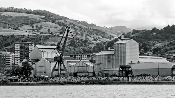 Industrial buildings with crane by the water