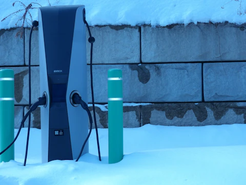 Electric car charging station covered in snow