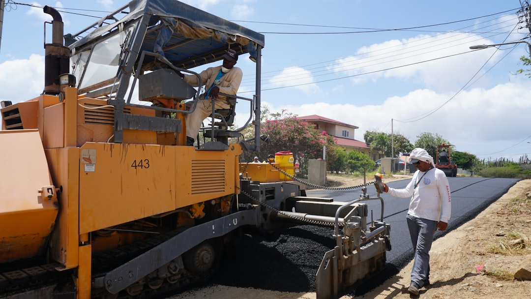 asphalt paving machine at work asphalt paving machine at work