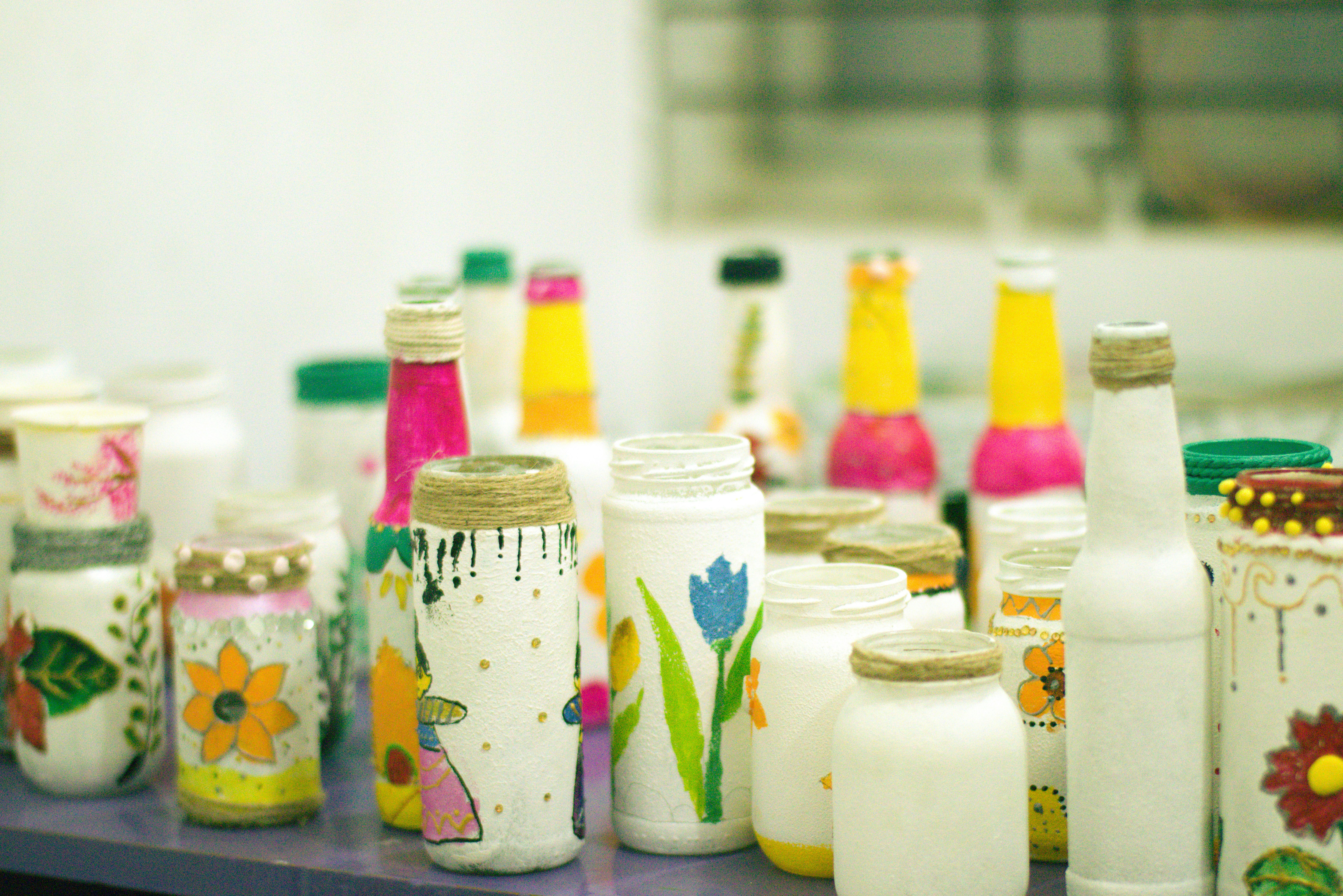 Decorated glass jars used for stylish pantry storage - cheap diy home organization hacks