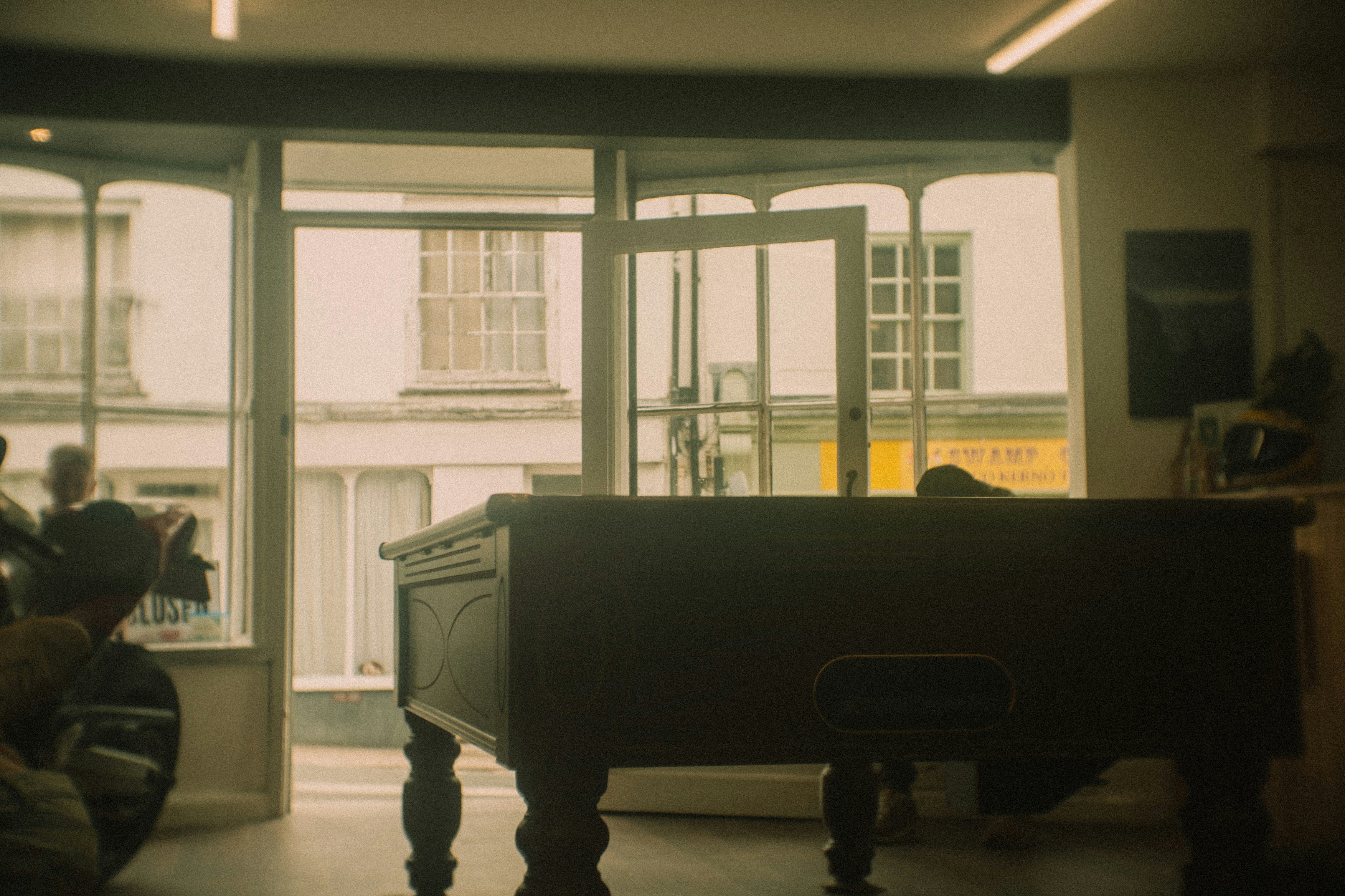 A vintage pool table in a dimly lit room.
