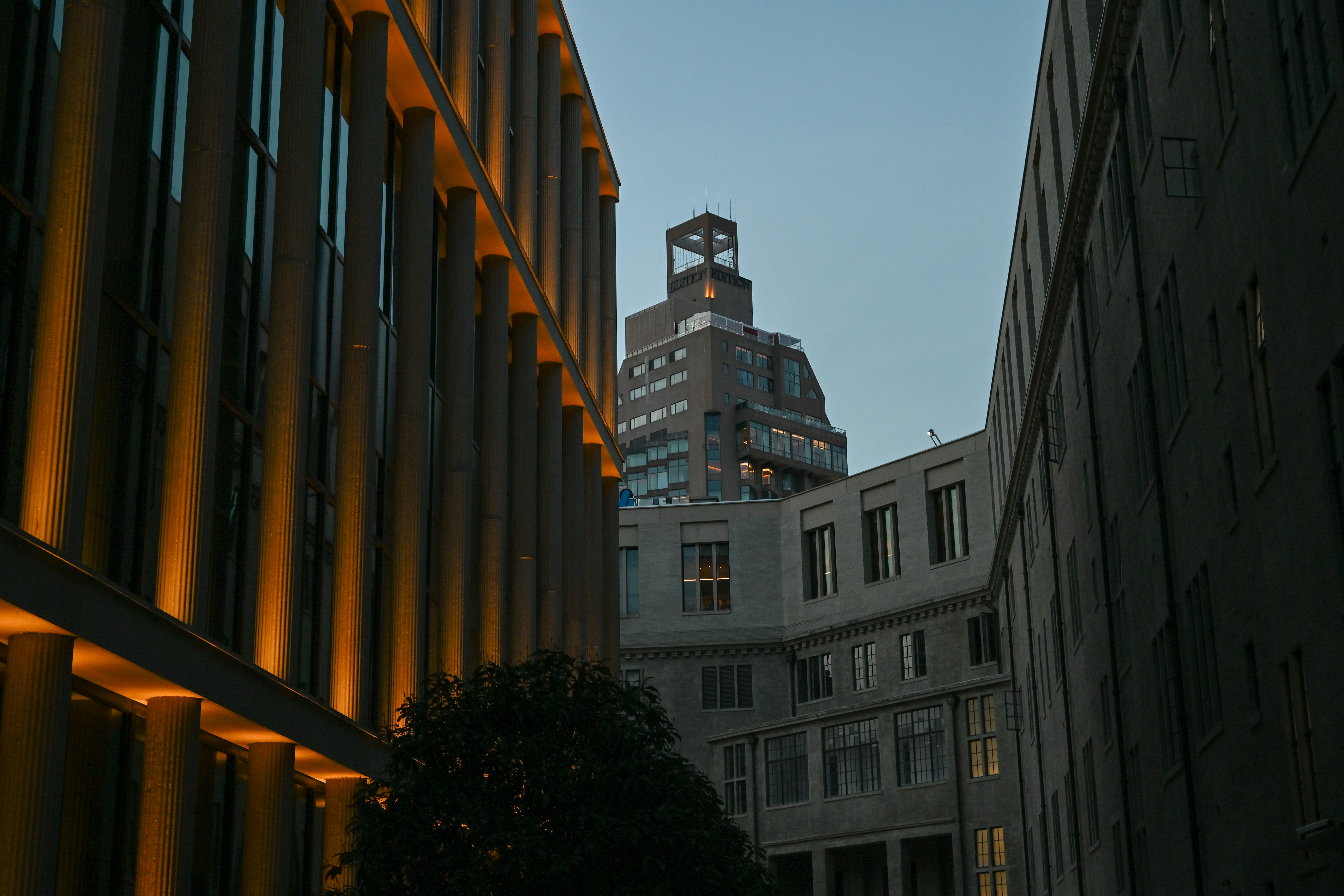 Modern buildings with warm lights at dusk
