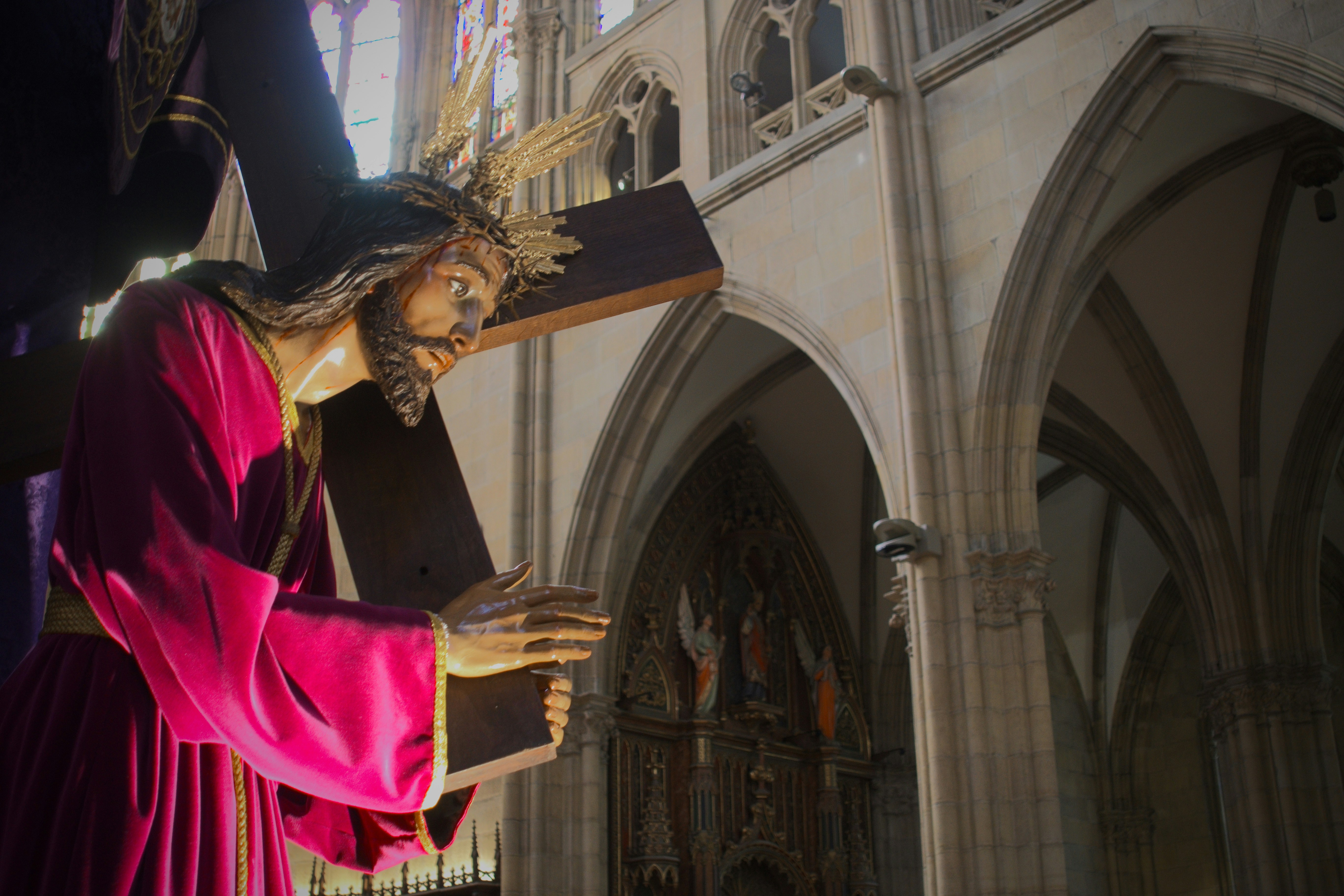 Statue of jesus carrying the cross in a church