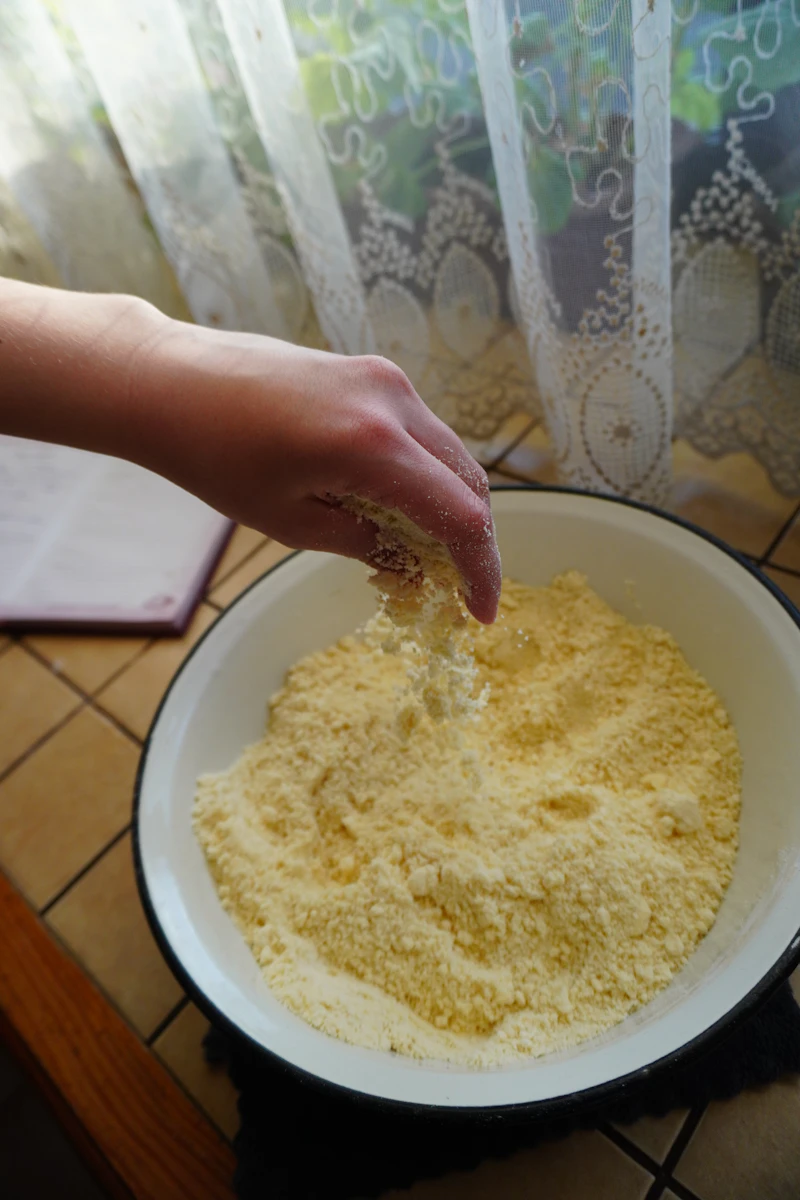Hands preparing a meal together in a residential kitchen