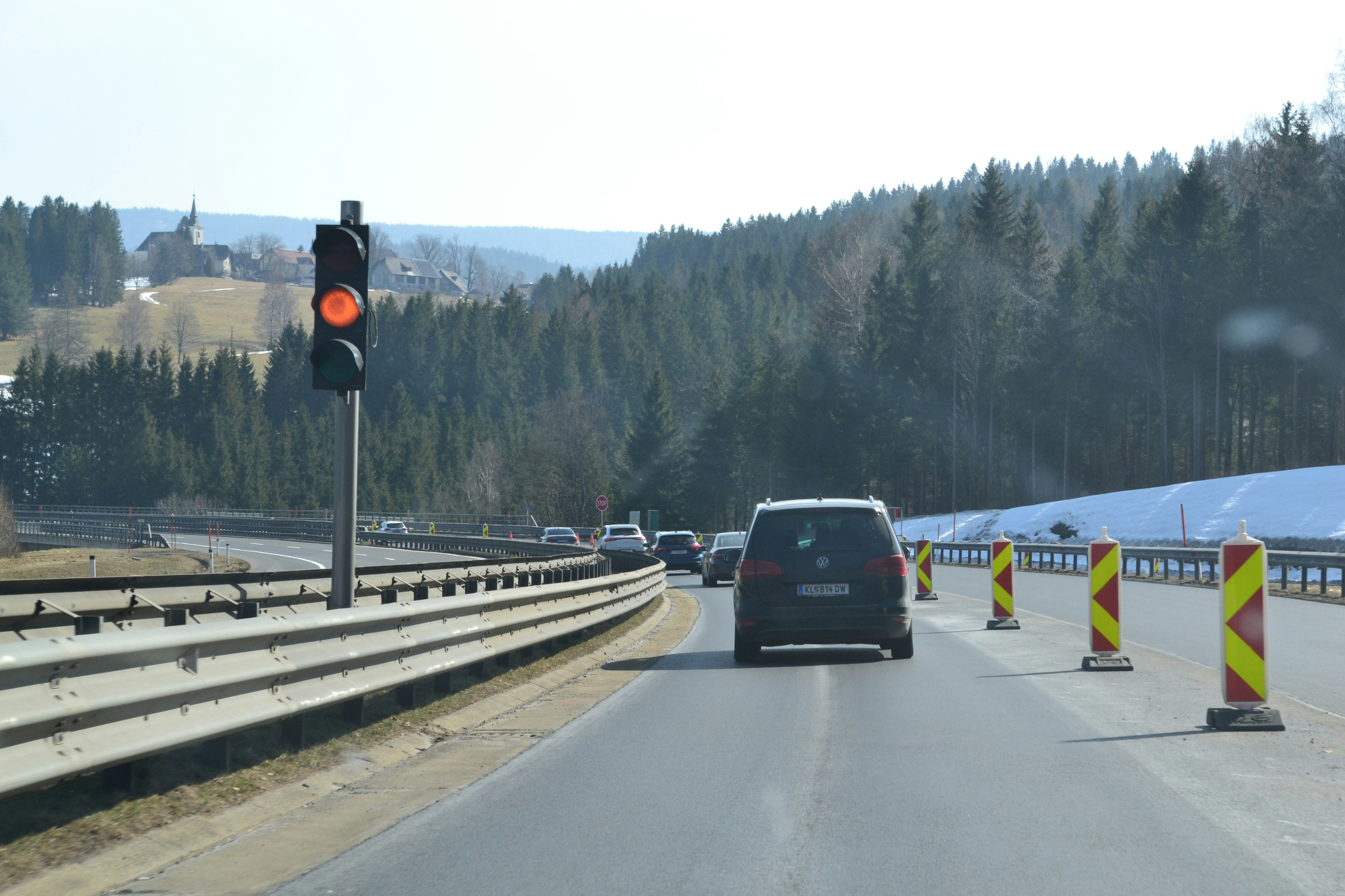 Traffic light signals construction zone on a highway.