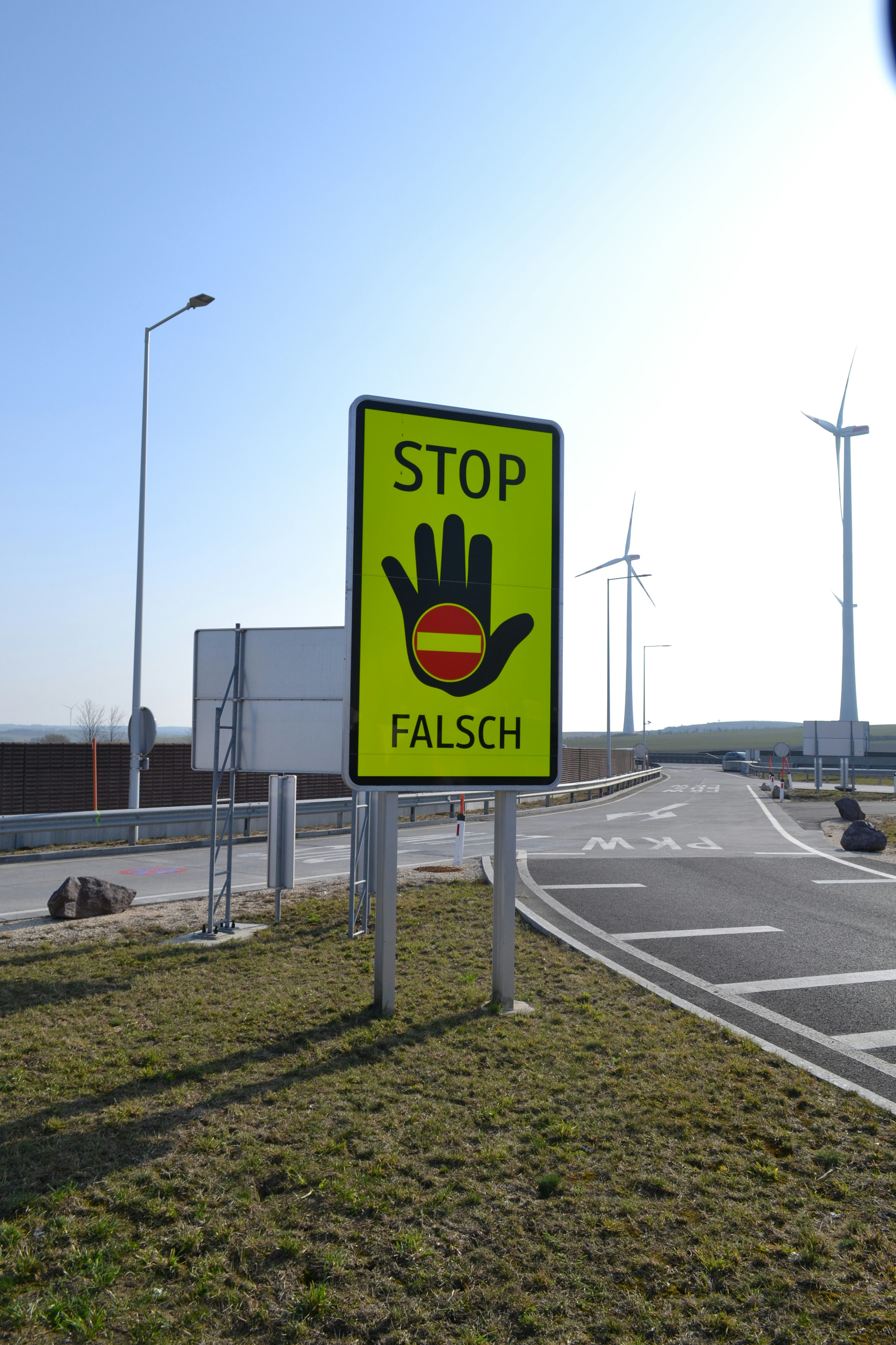 Stop sign with hand and spanish flag