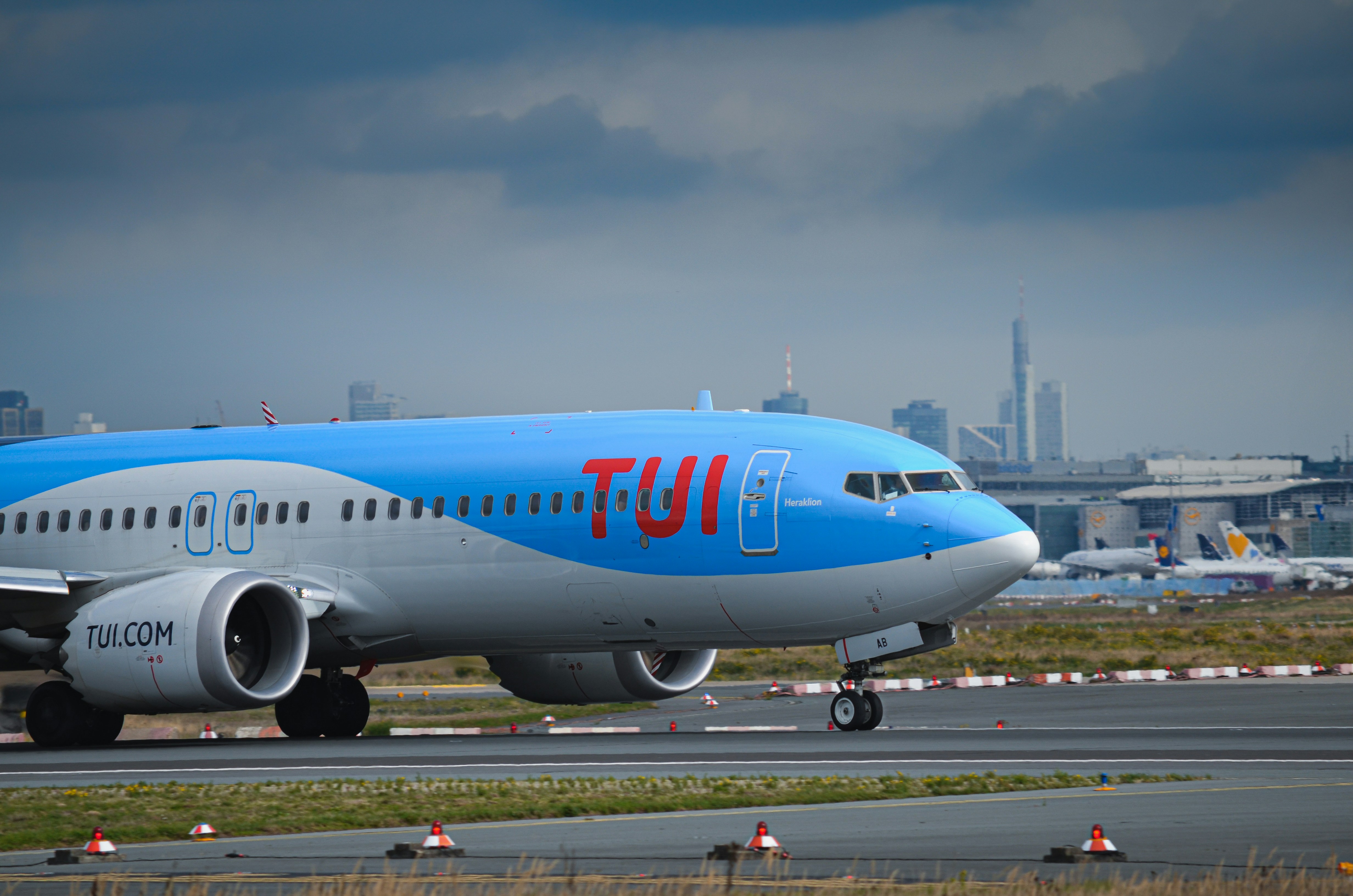 A tui airplane on the tarmac at an airport.