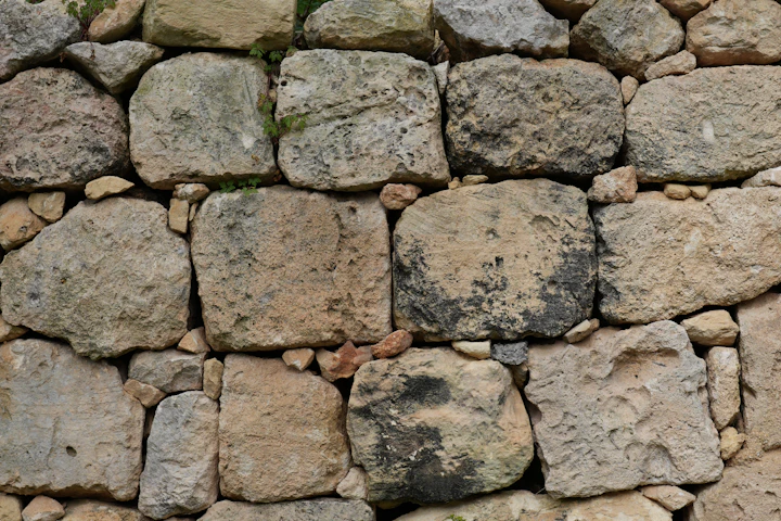 A textured drystone wall made of rough, irregular stones — the masonry the show records on location