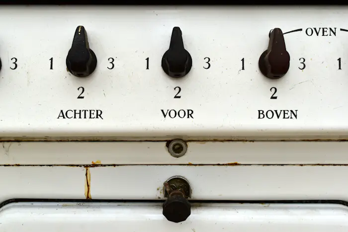 Stove control knobs and settings, the type our Marlton technicians repair