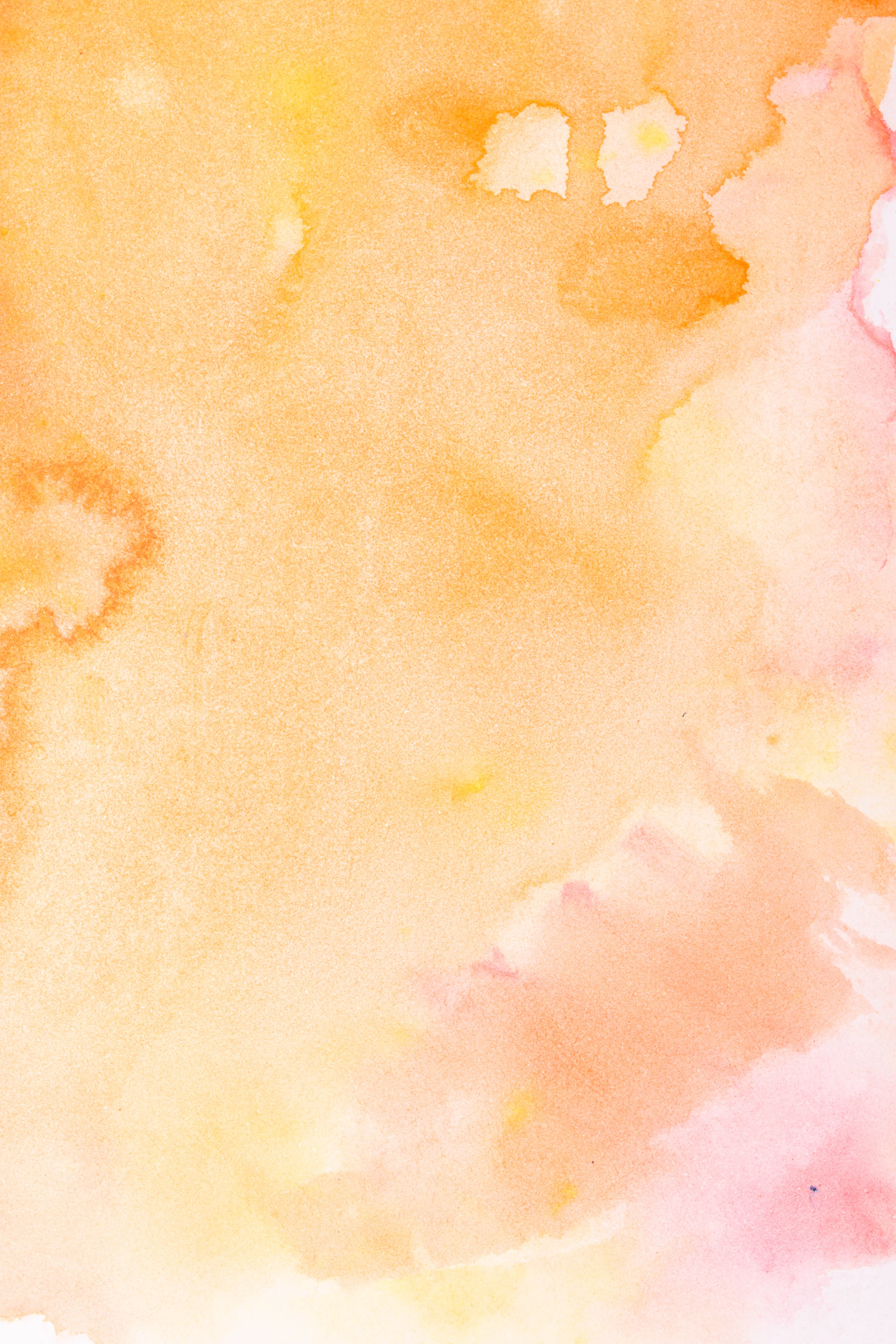 Soft watercolor washes in orange and pink hues.