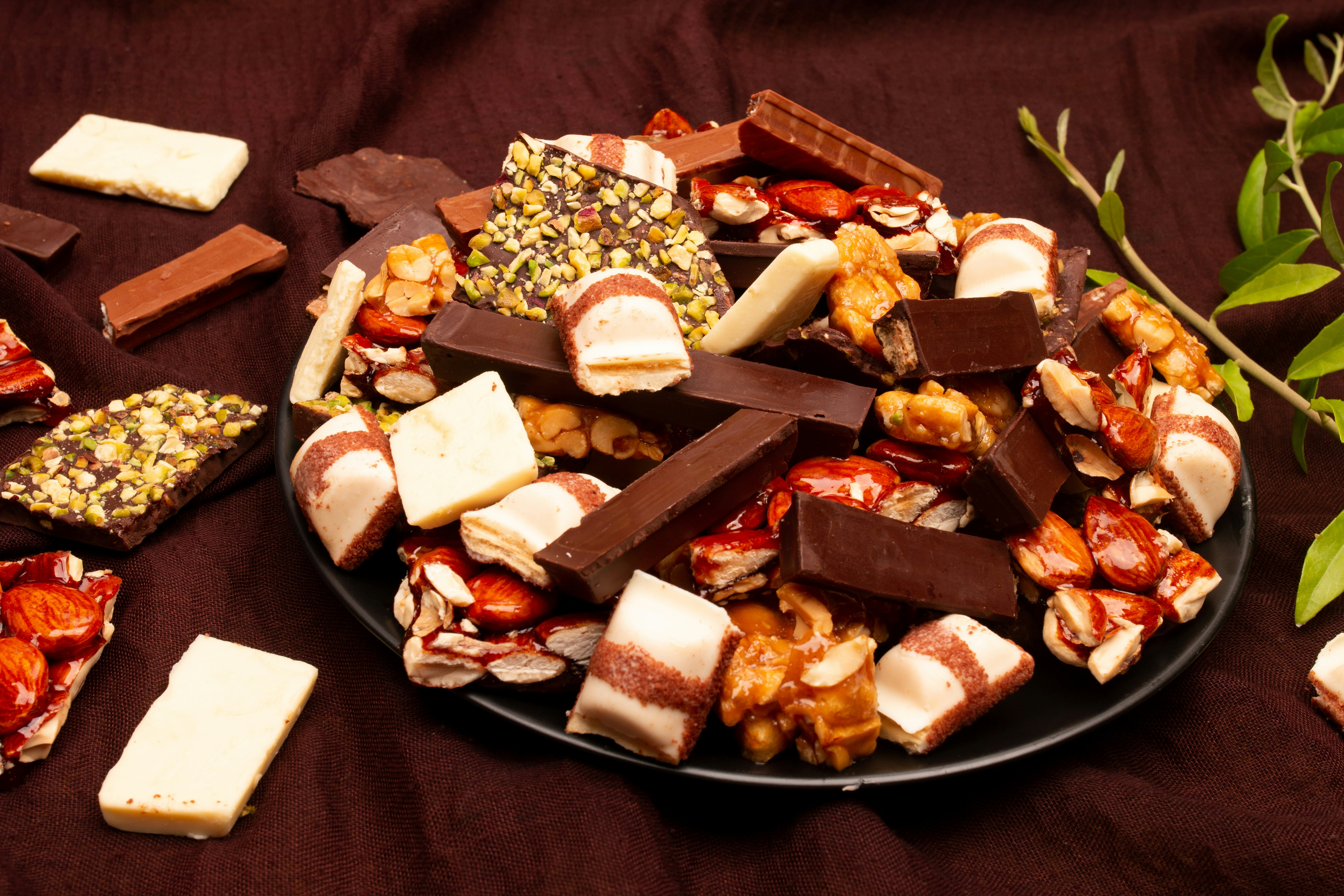 A platter overflowing with assorted chocolates and candies