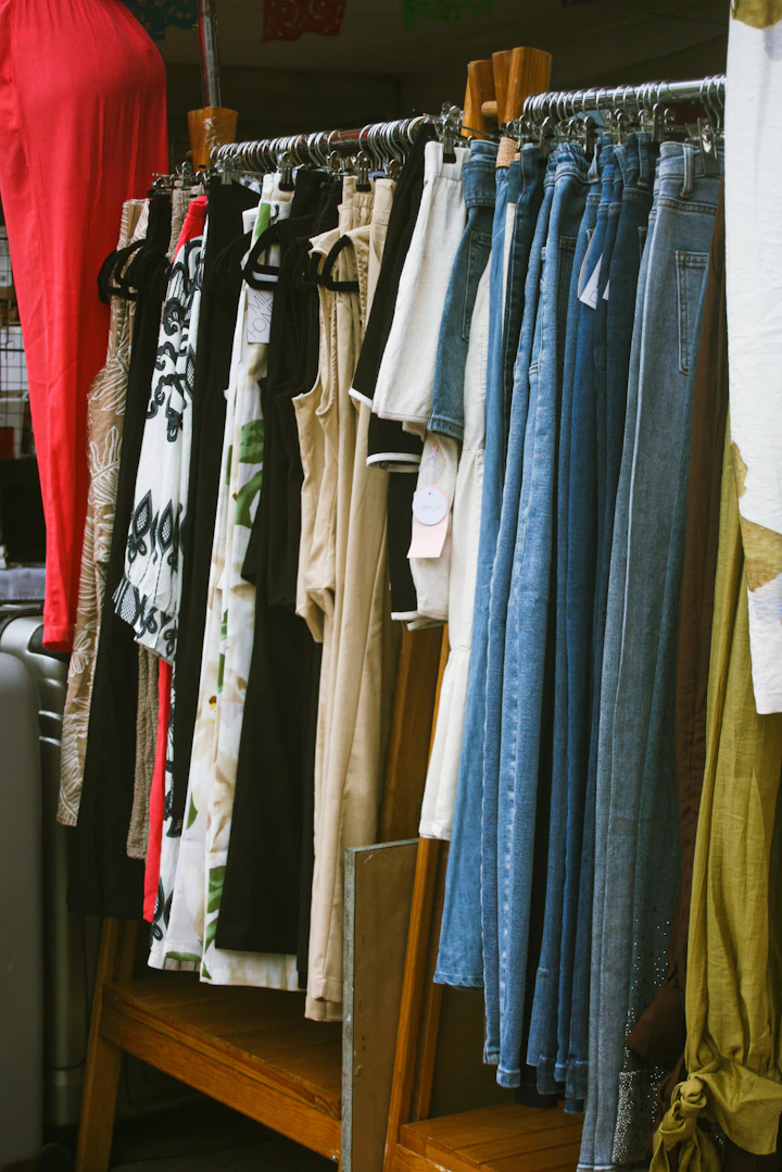 Assortment of clothing items hanging on a rack