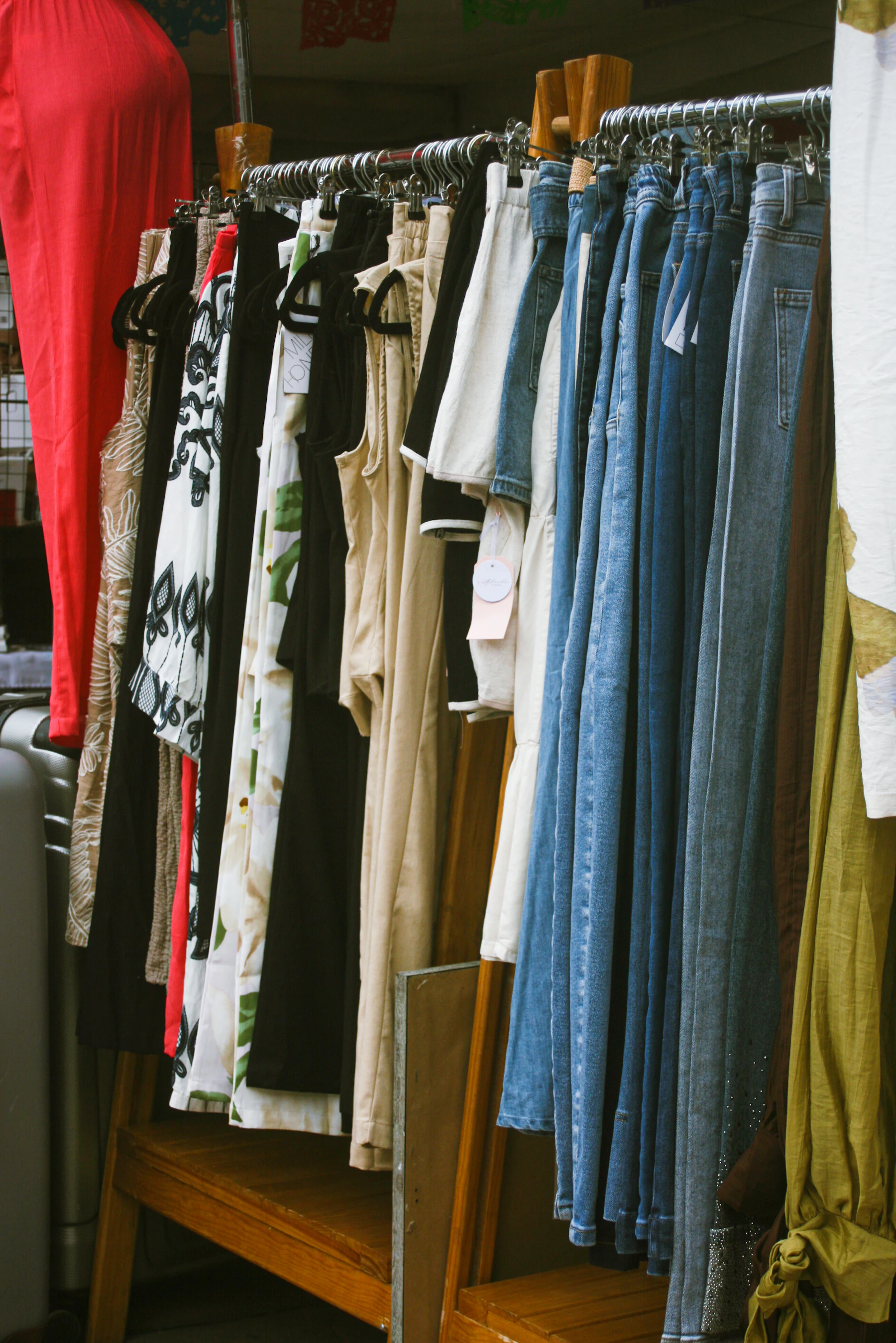 Assortment of clothing items hanging on a rack