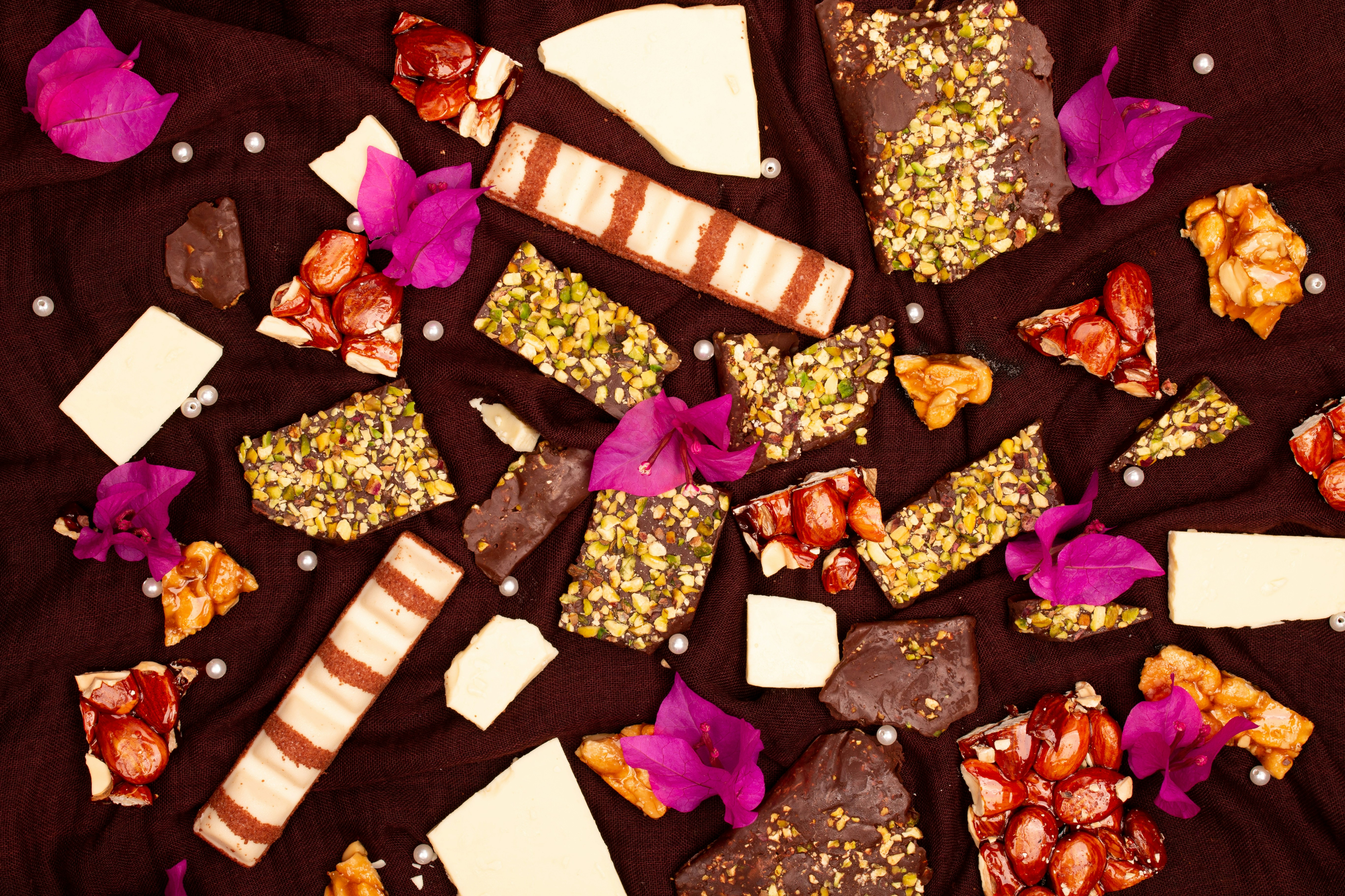 Assortment of chocolates and candies with flowers