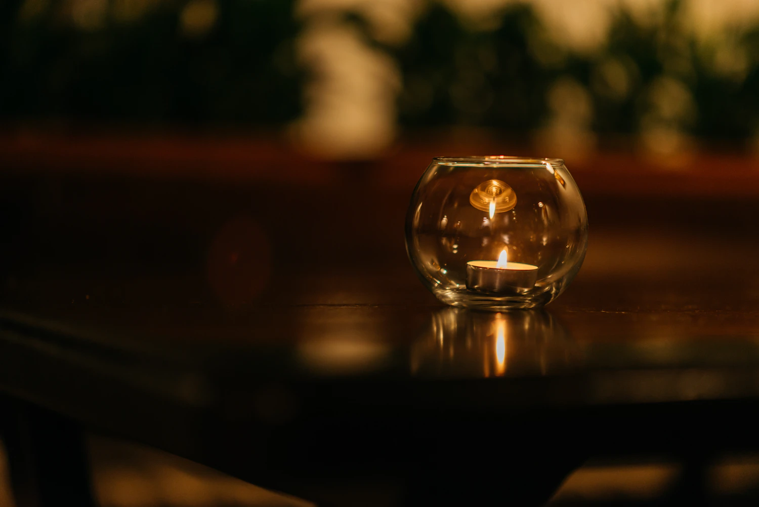 Cashel No. 6 burning in a round glass bowl on a dark table