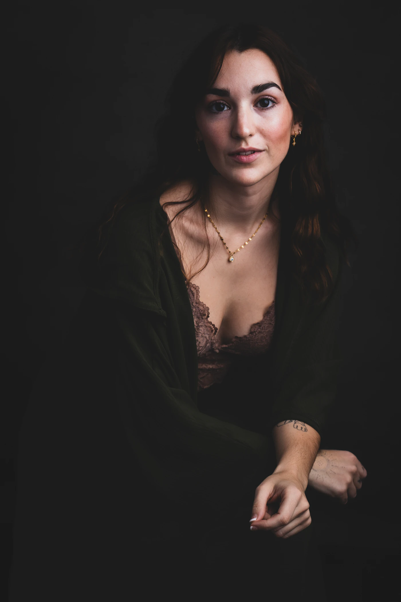 Artist portrait in a dark studio for brand direction