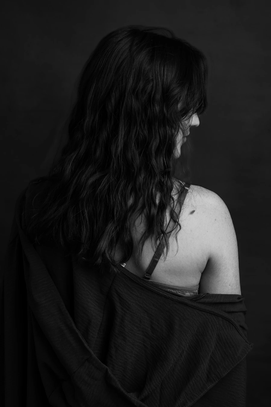 Before: long dark hair with a flat, grown-out base, seen from behind