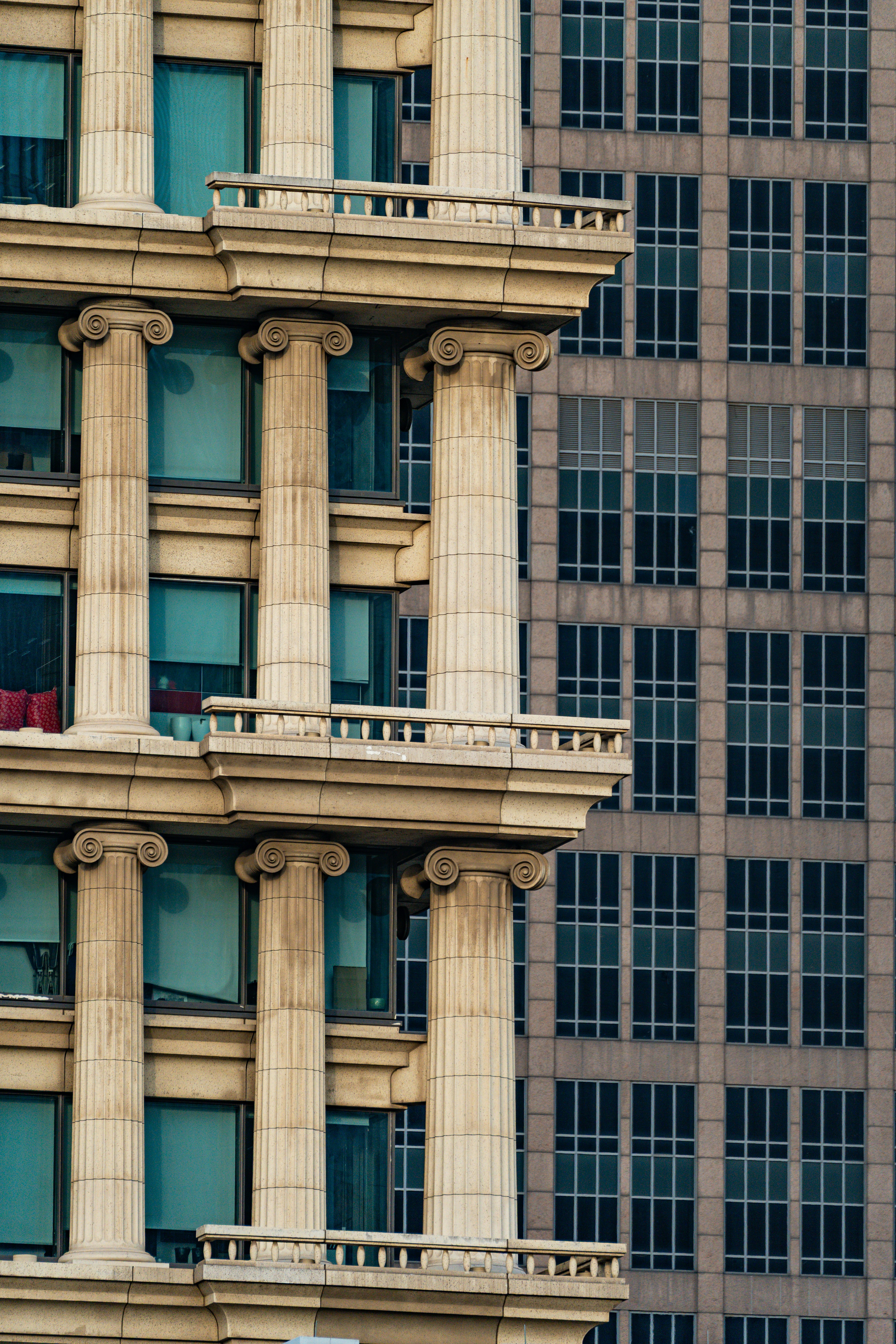 Classical columns on building next to modern facade