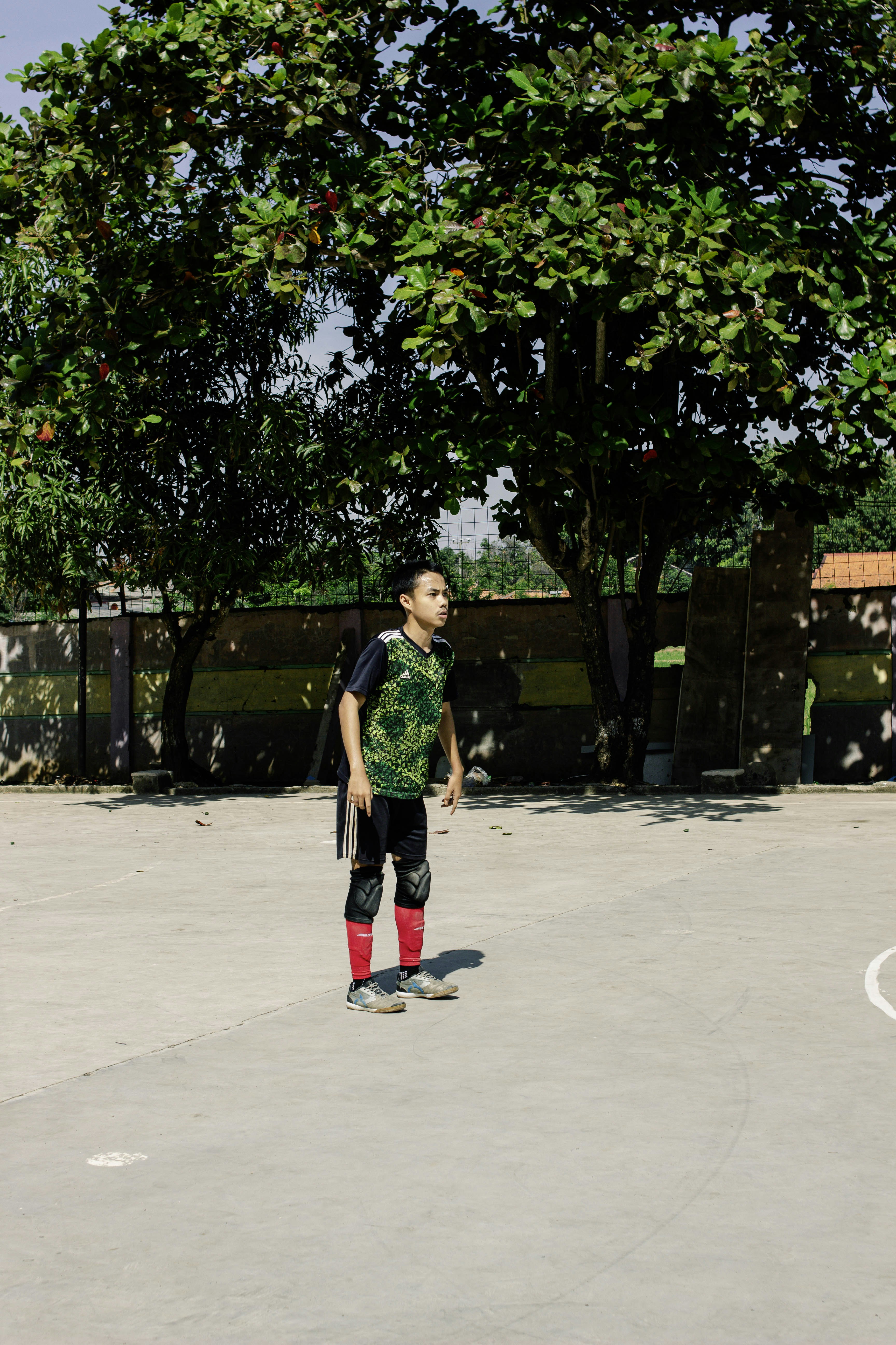 Young man in athletic wear standing outdoors