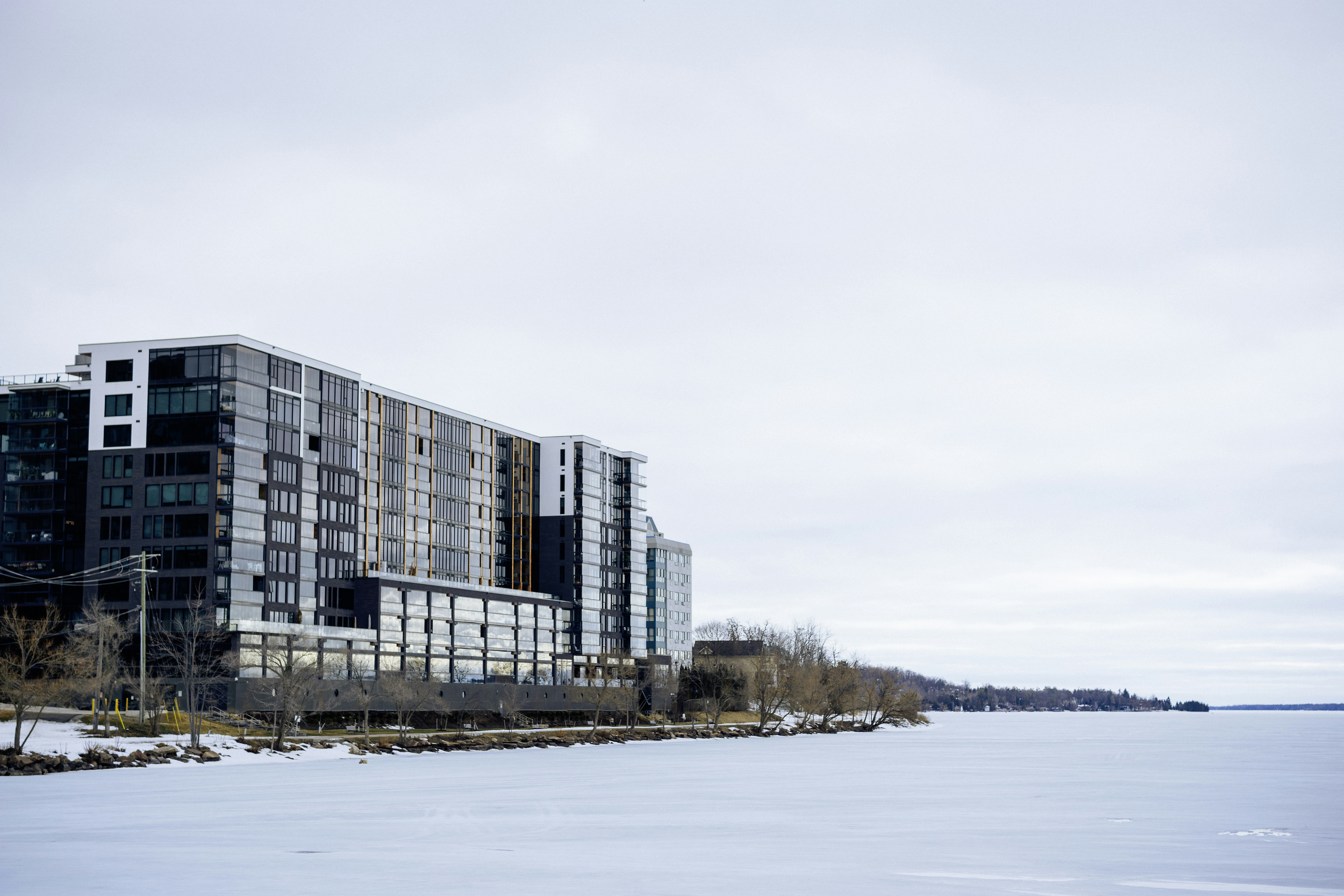 Modern apartment building on a frozen waterfront