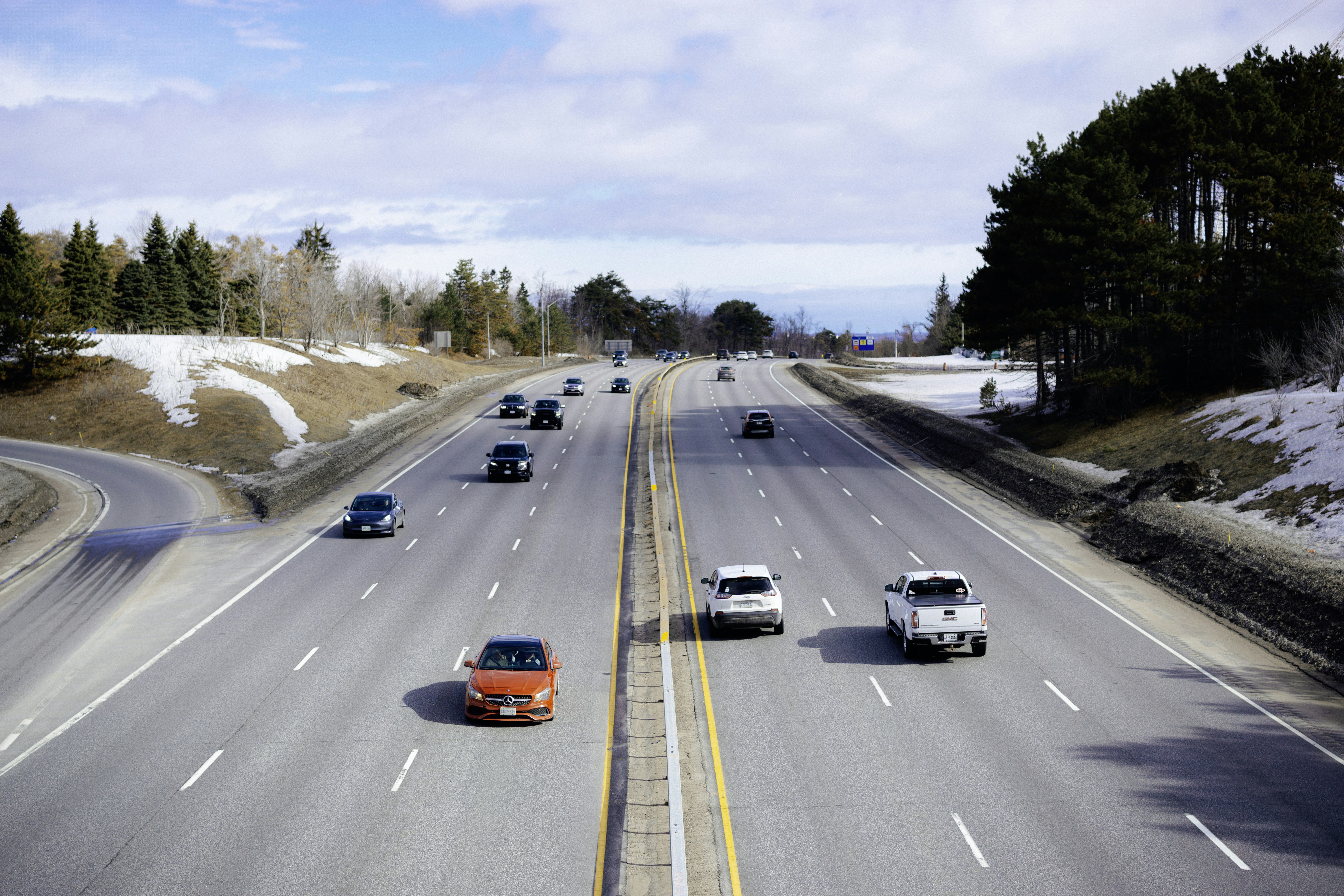 Cars driving on a highway in winter