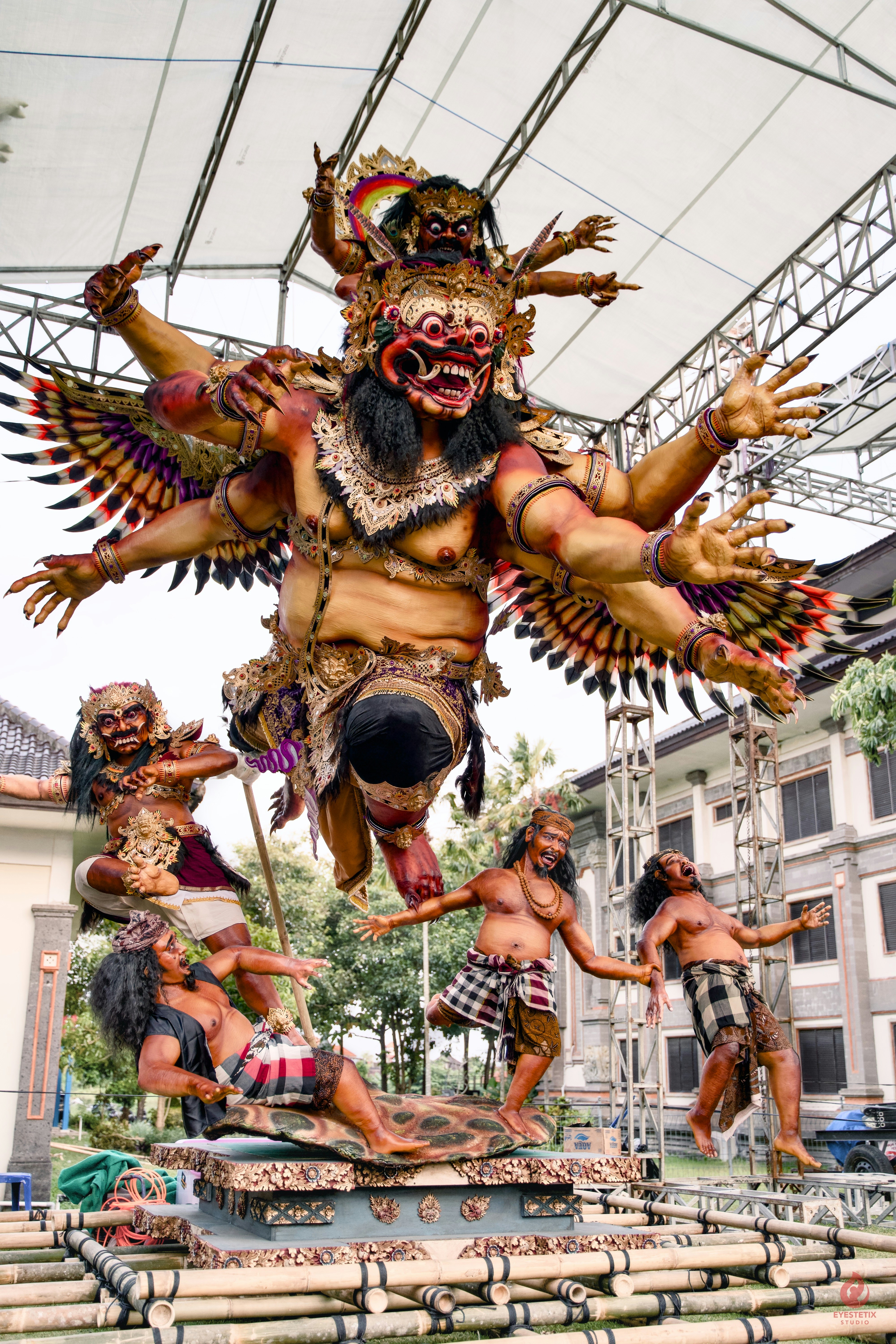 Elaborate balinese statue of a multi-armed demon