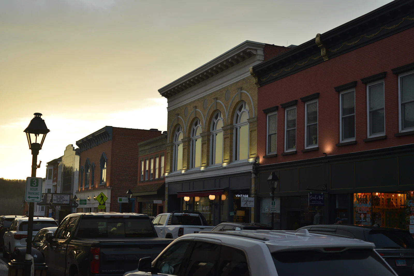 Historic downtown storefronts glowing at dusk near Nevada City's Gold Rush theater district