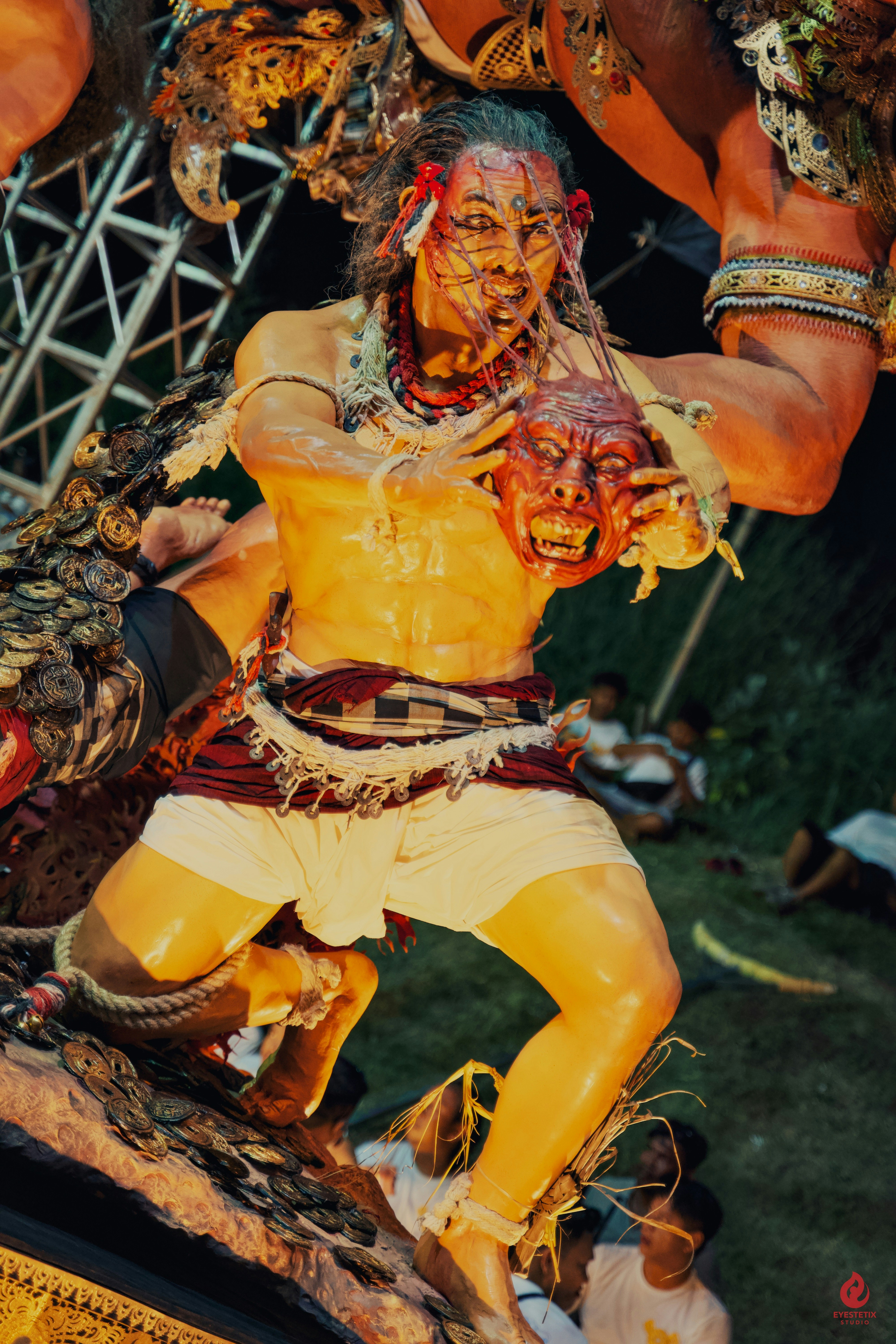 A detailed statue of a man holding a severed head.