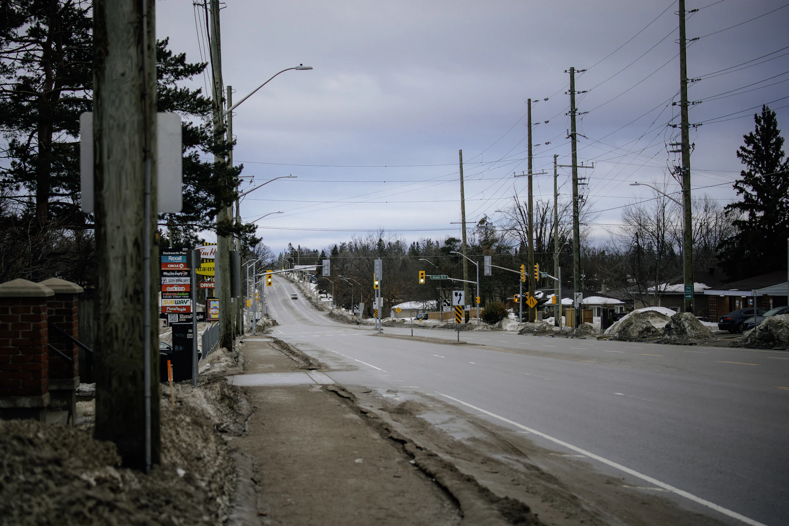 A snow-covered road runs through Barrie in Ontario