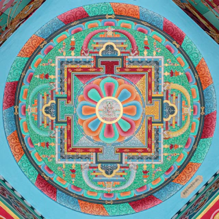 Intricate colorful mandala painted on a ceiling