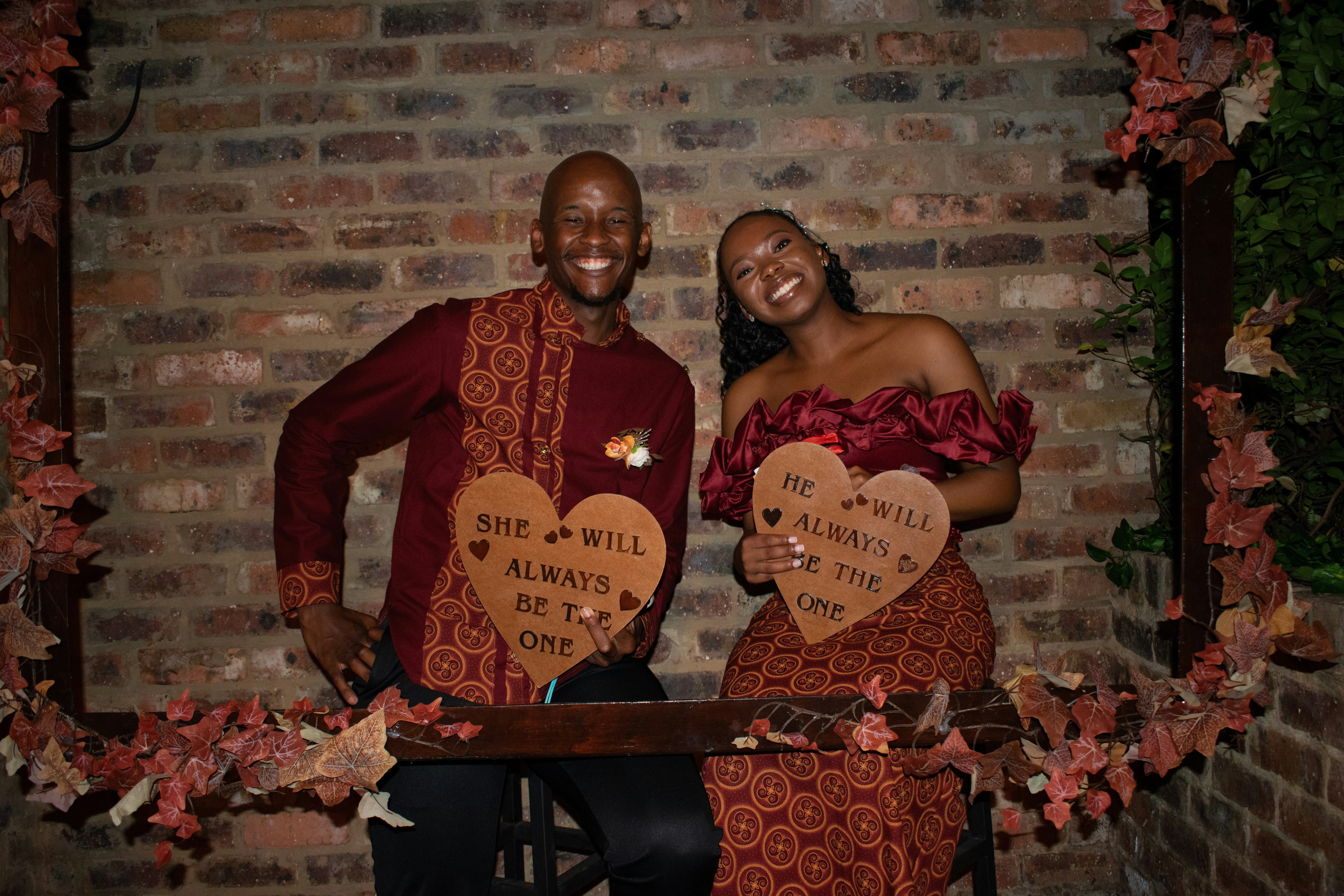 Couple holding heart signs with text