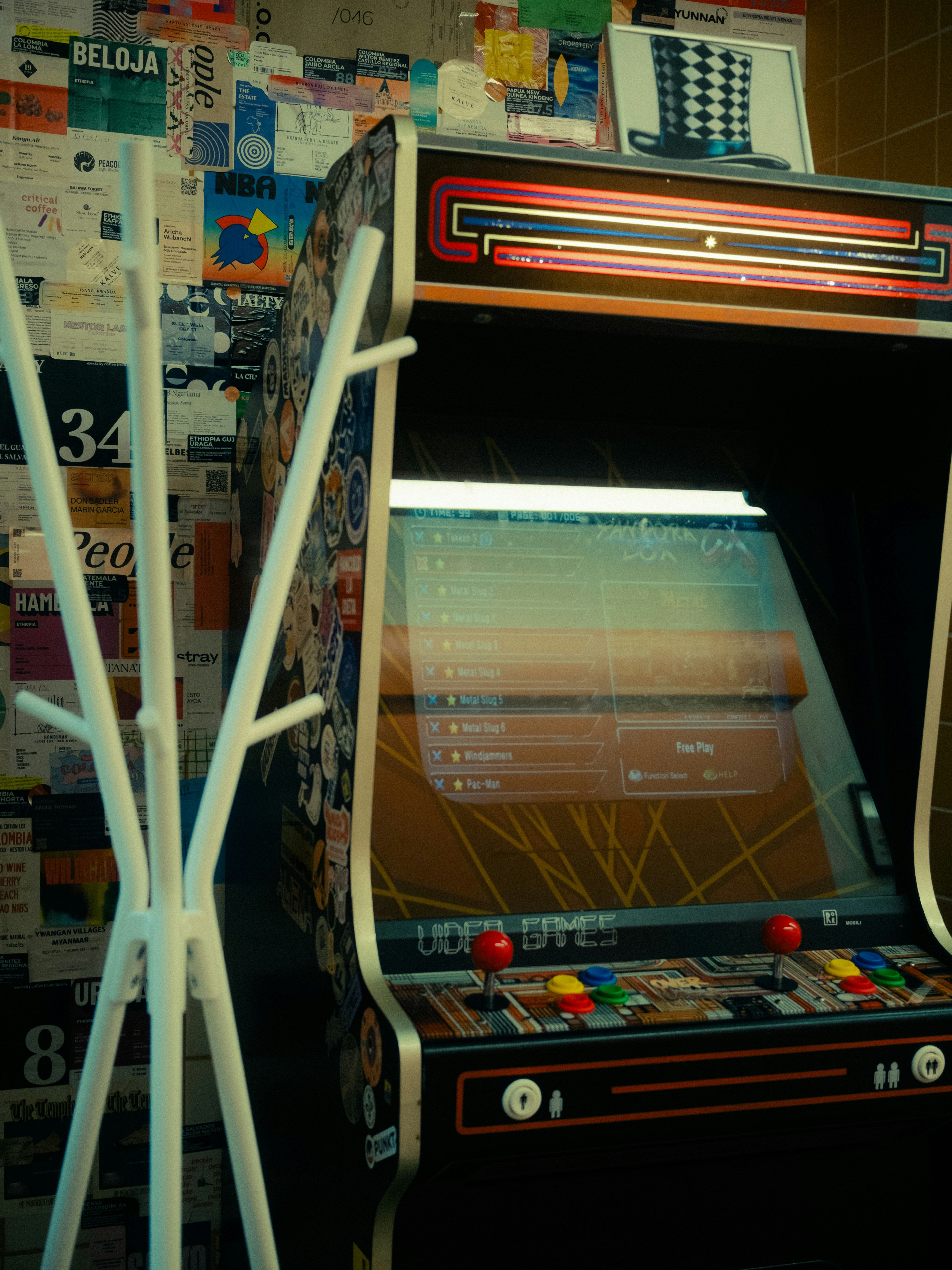 Vintage arcade game machine with colorful buttons and retro design elements