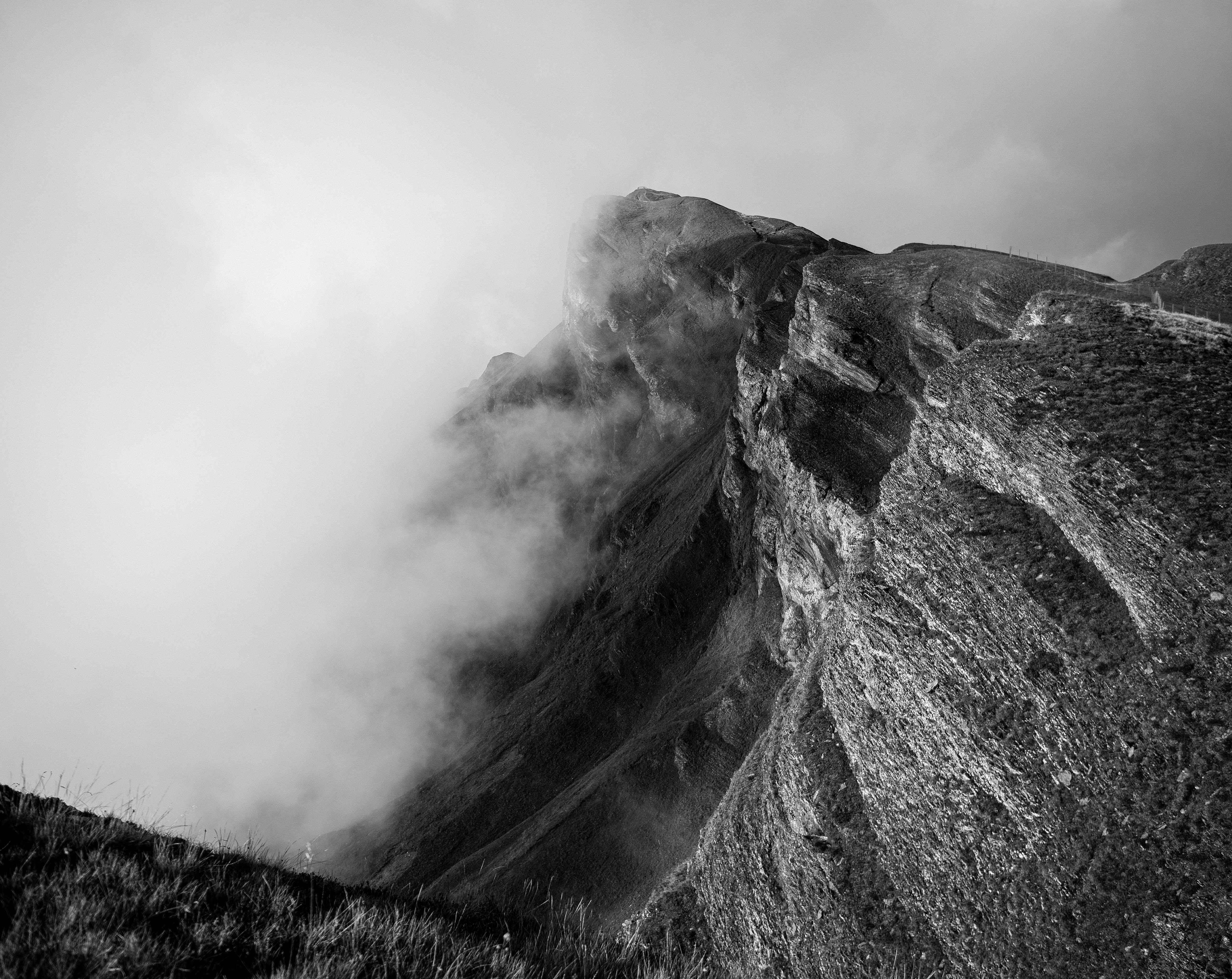 Jagged mountain peak shrouded in mist