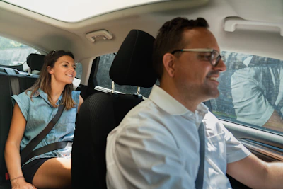 Man and woman in car during daytime